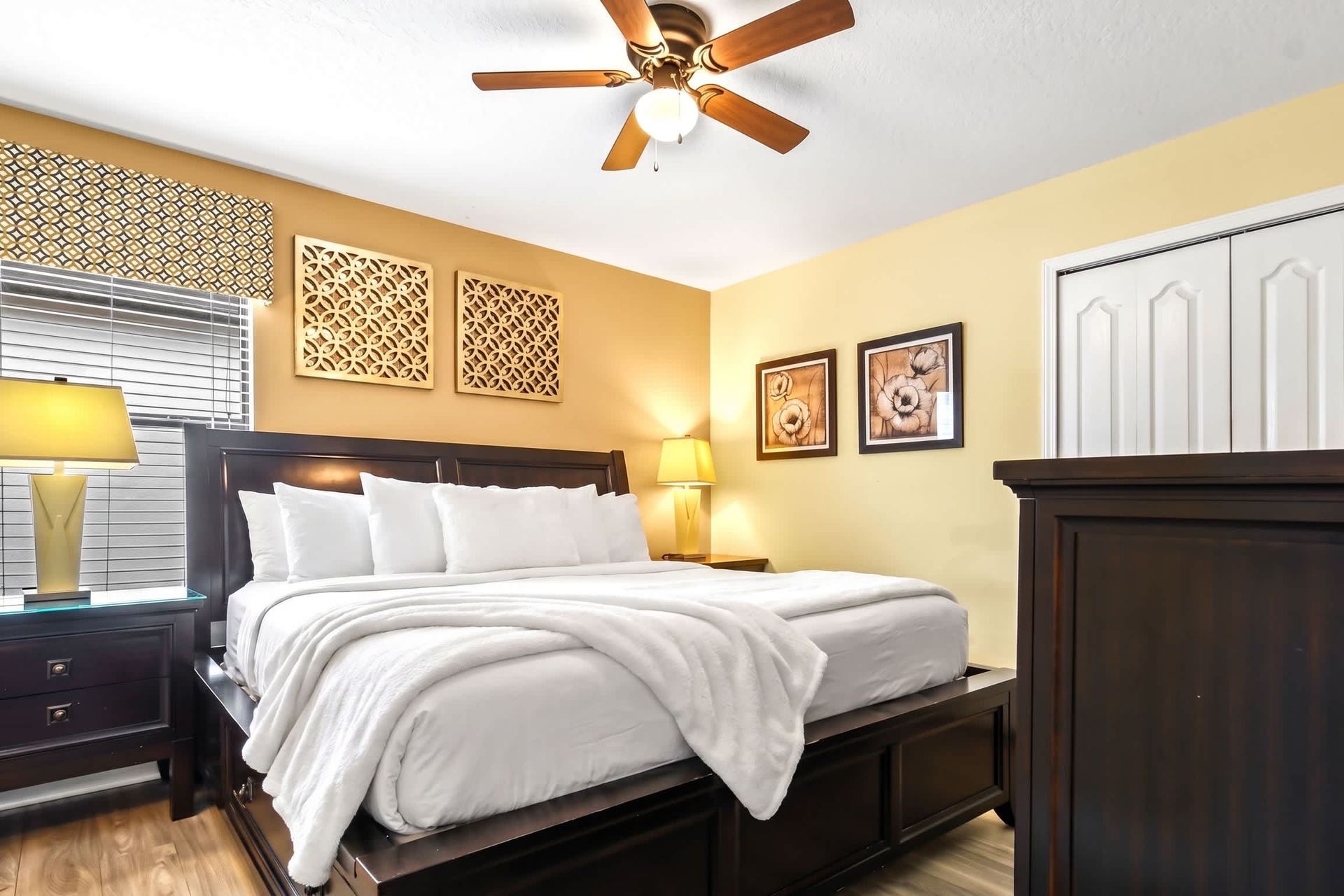 A bedroom with a luxurious king-sized bed complemented by a TV
