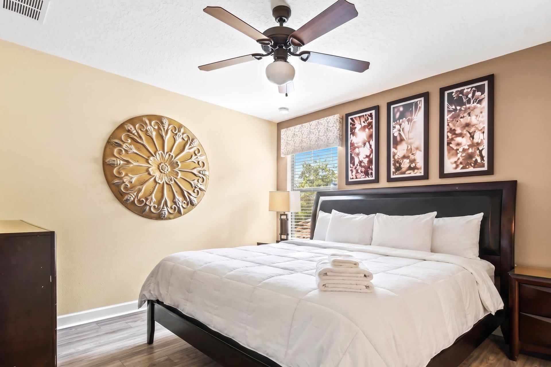 A bedroom with a luxurious king-sized bed complemented by a TV