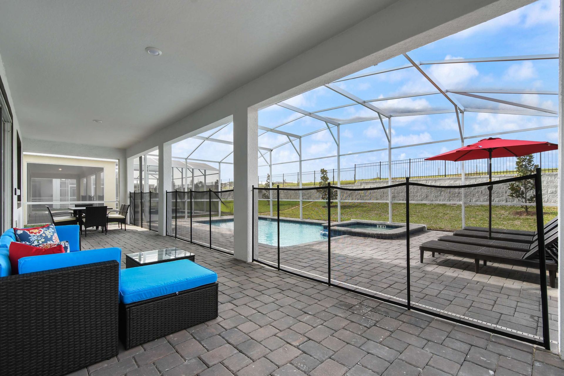 Relax by the pool in style with shaded seating, lounge chairs, and a hot tub.