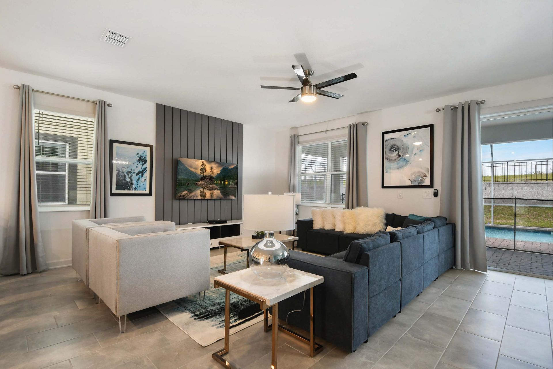 Stylish modern retreat with pool access, smart TV, and cozy lounge seating.
