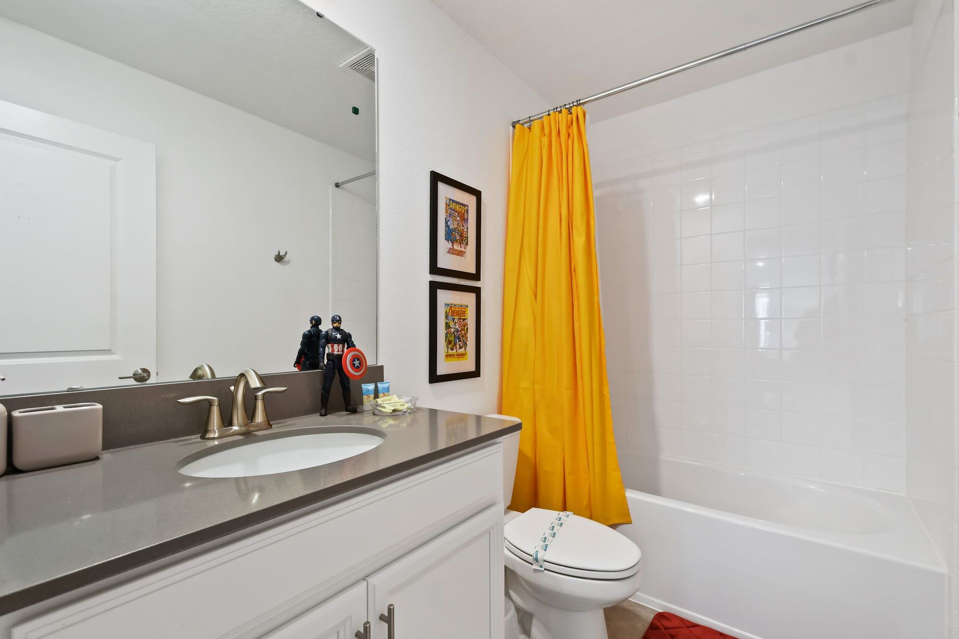 Fun superhero-themed bathroom with bright accents and a clean modern layout.