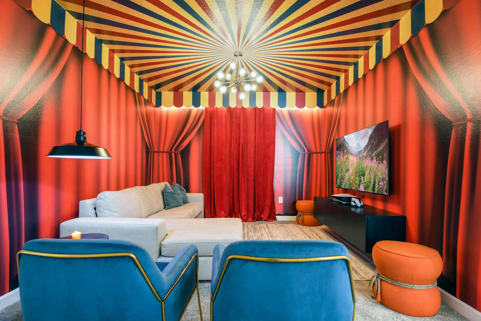 Whimsical circus-themed lounge with bold colors, cozy seating, and fun flair.