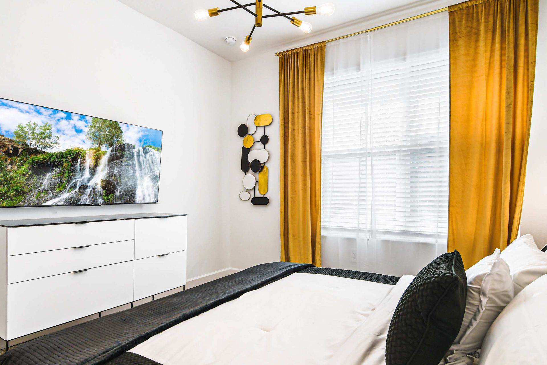 Experience luxury and comfort in our spacious bedroom, promising you a restful night's sleep.