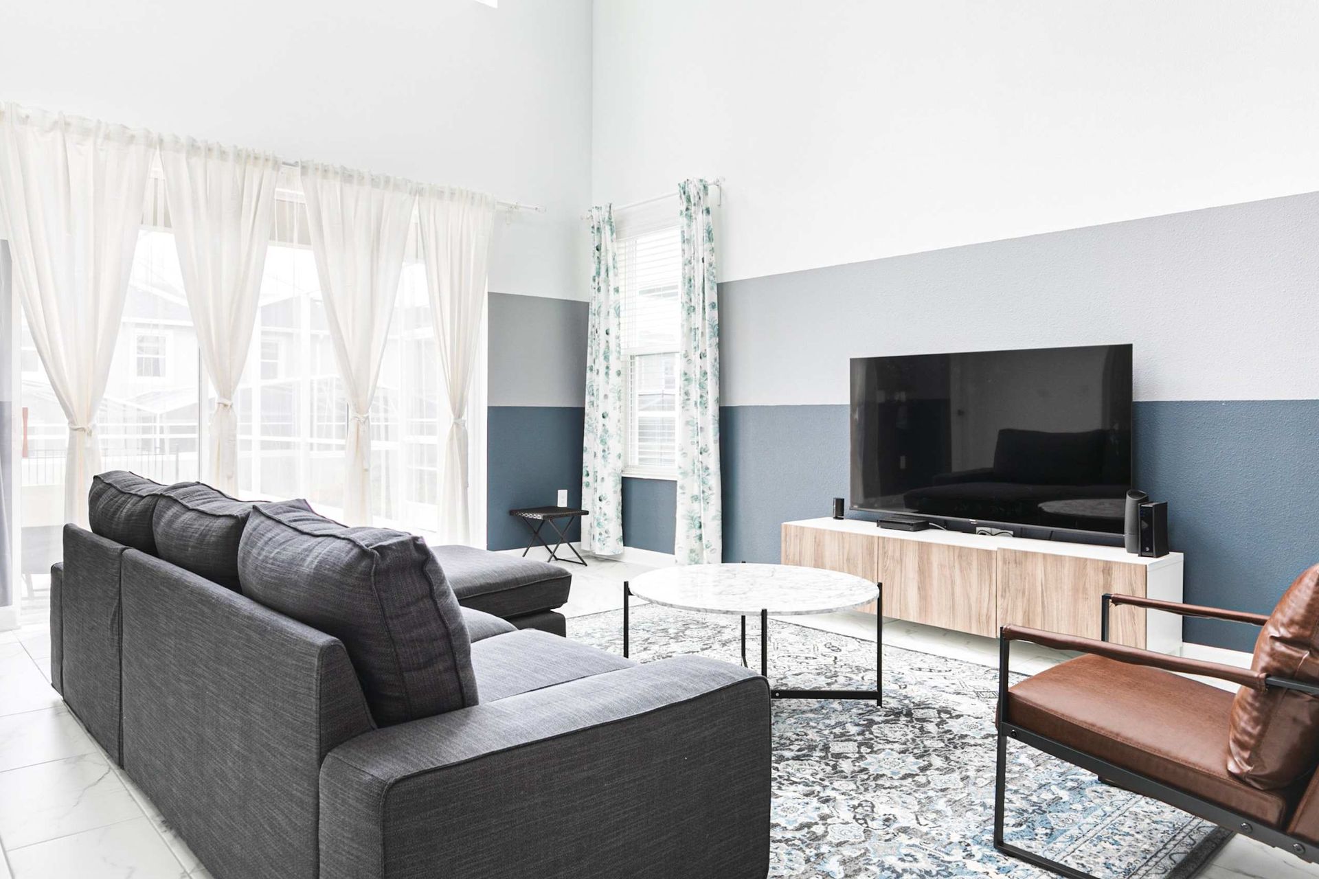 Enjoy quality time with loved ones in our inviting living room, offering a cozy space for relaxation.