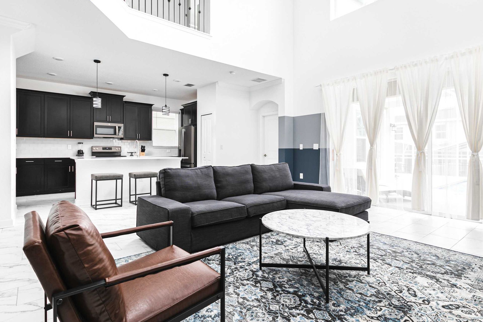 Enjoy quality time with loved ones in our inviting living room, offering a cozy space for relaxation.