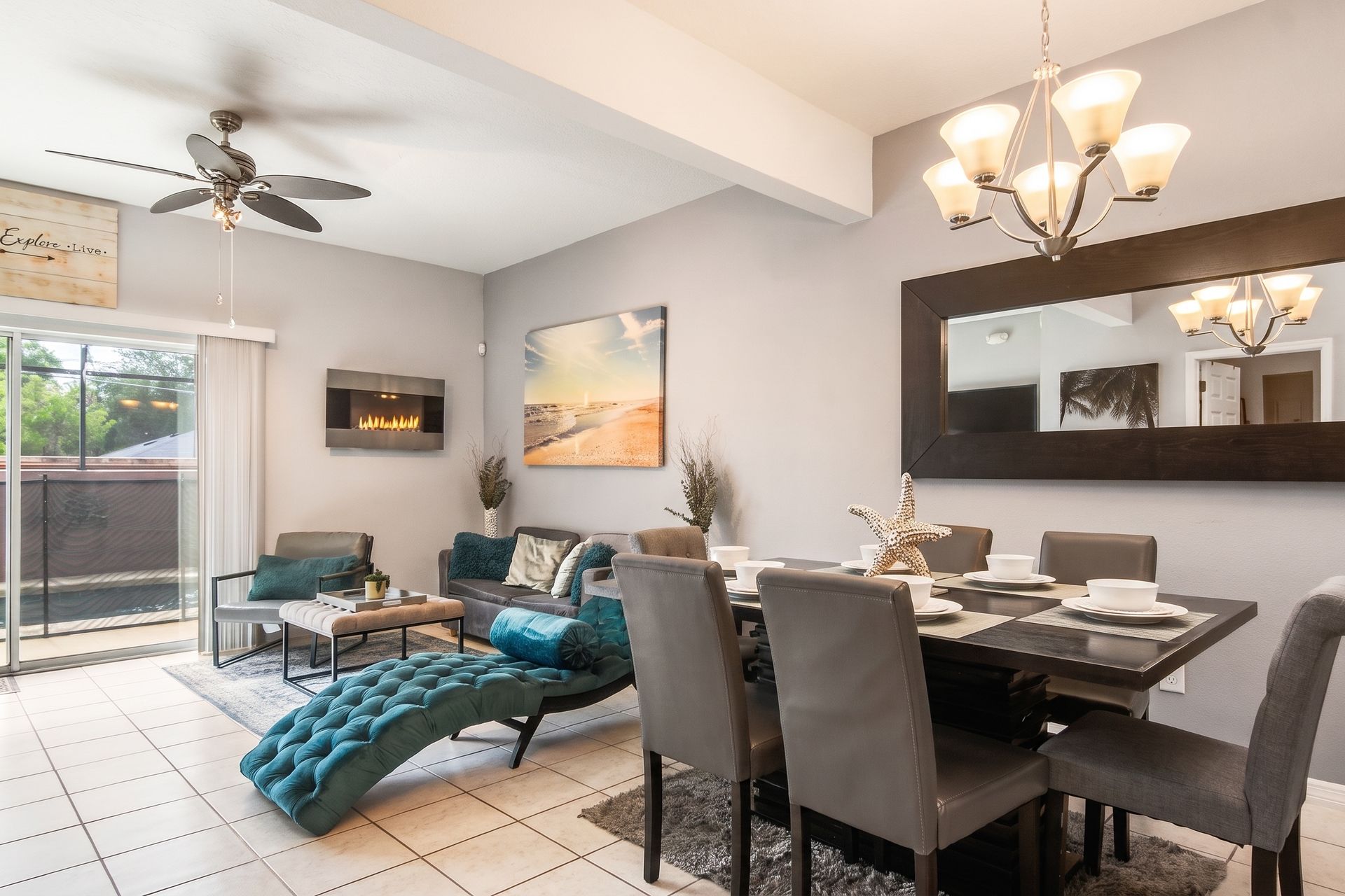 Elegant dining and living space with pool view and cozy fireplace!