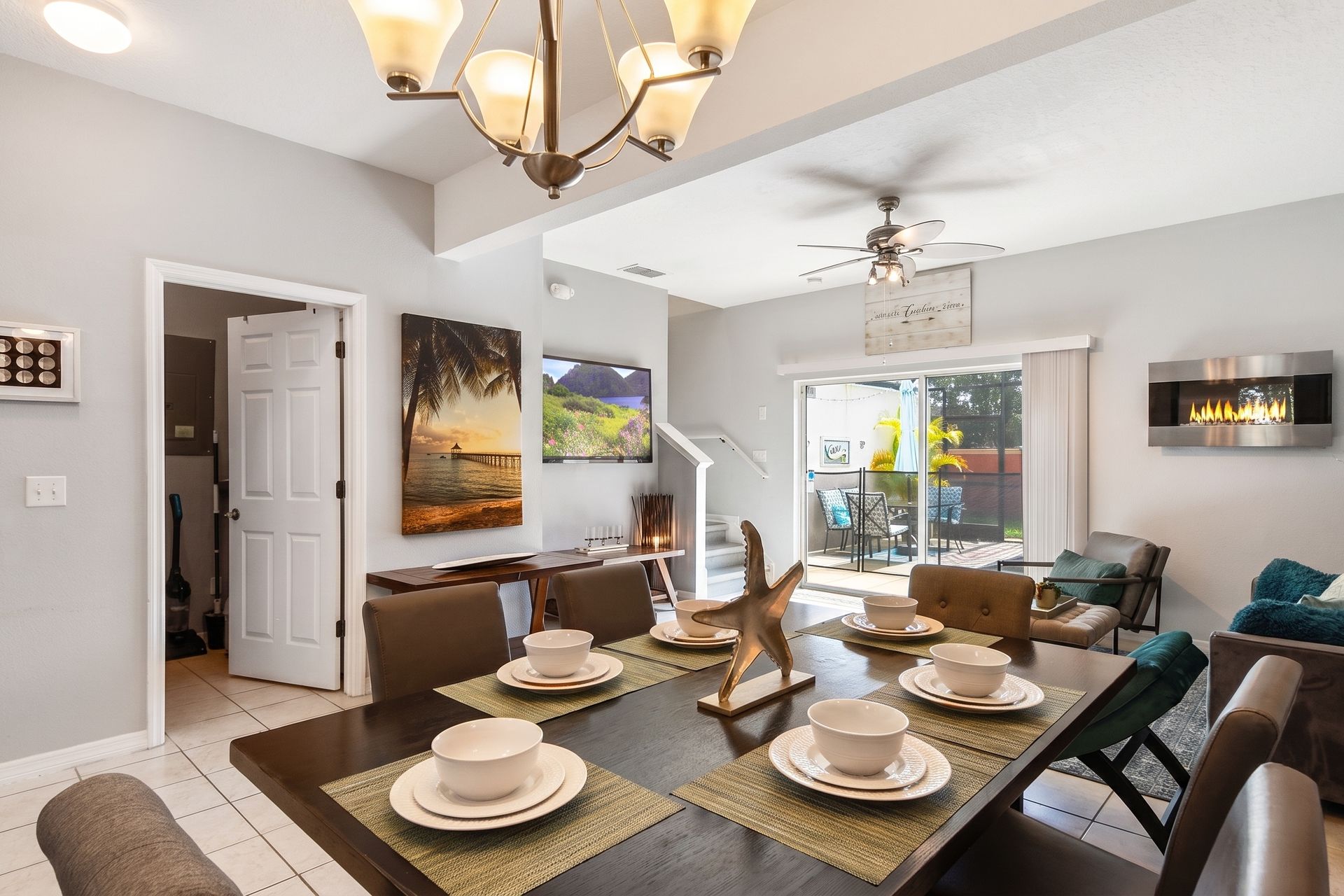 Spacious dining area flowing into a stylish living room with patio!