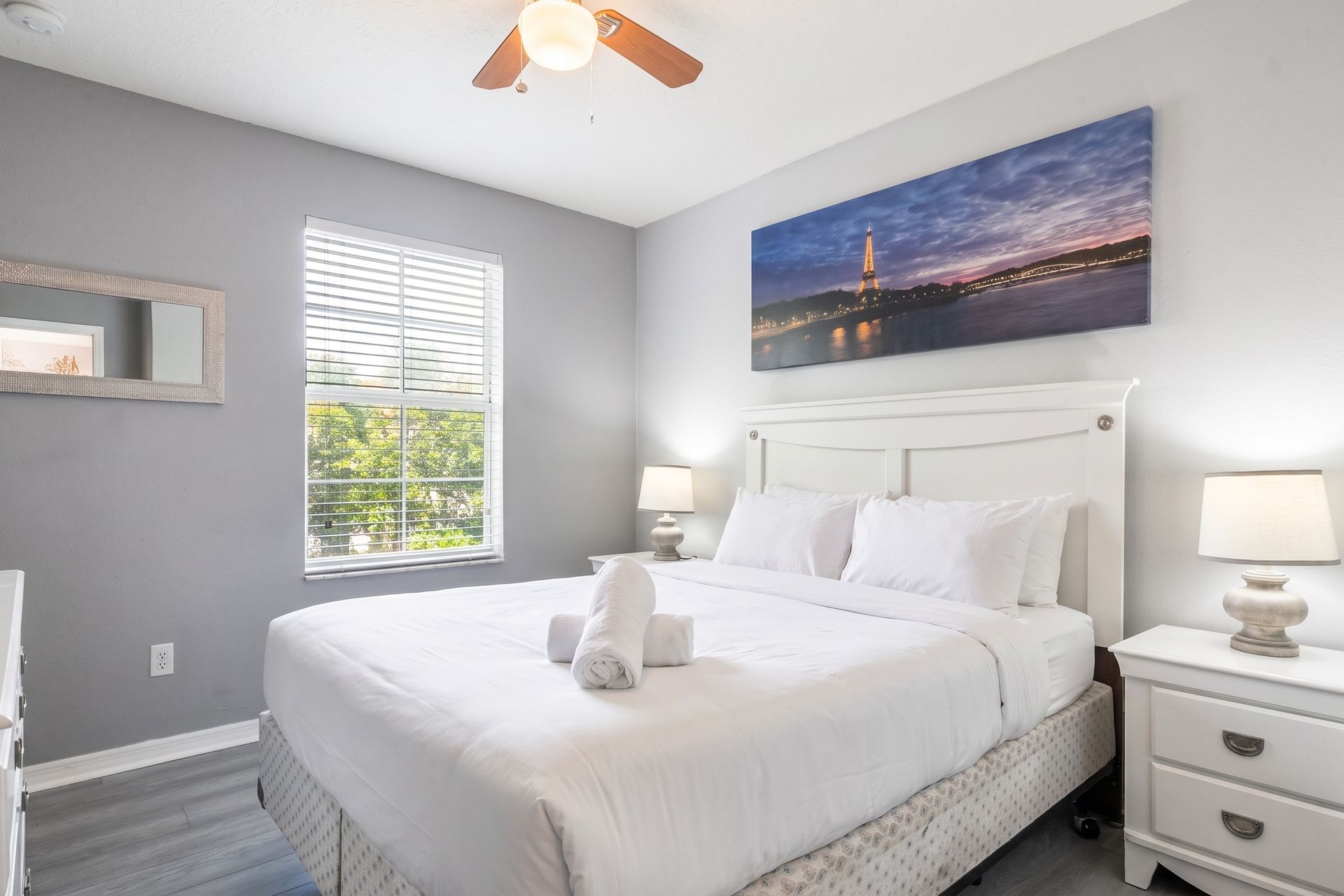 Tranquil bedroom with cozy decor, natural light, and plush bedding!