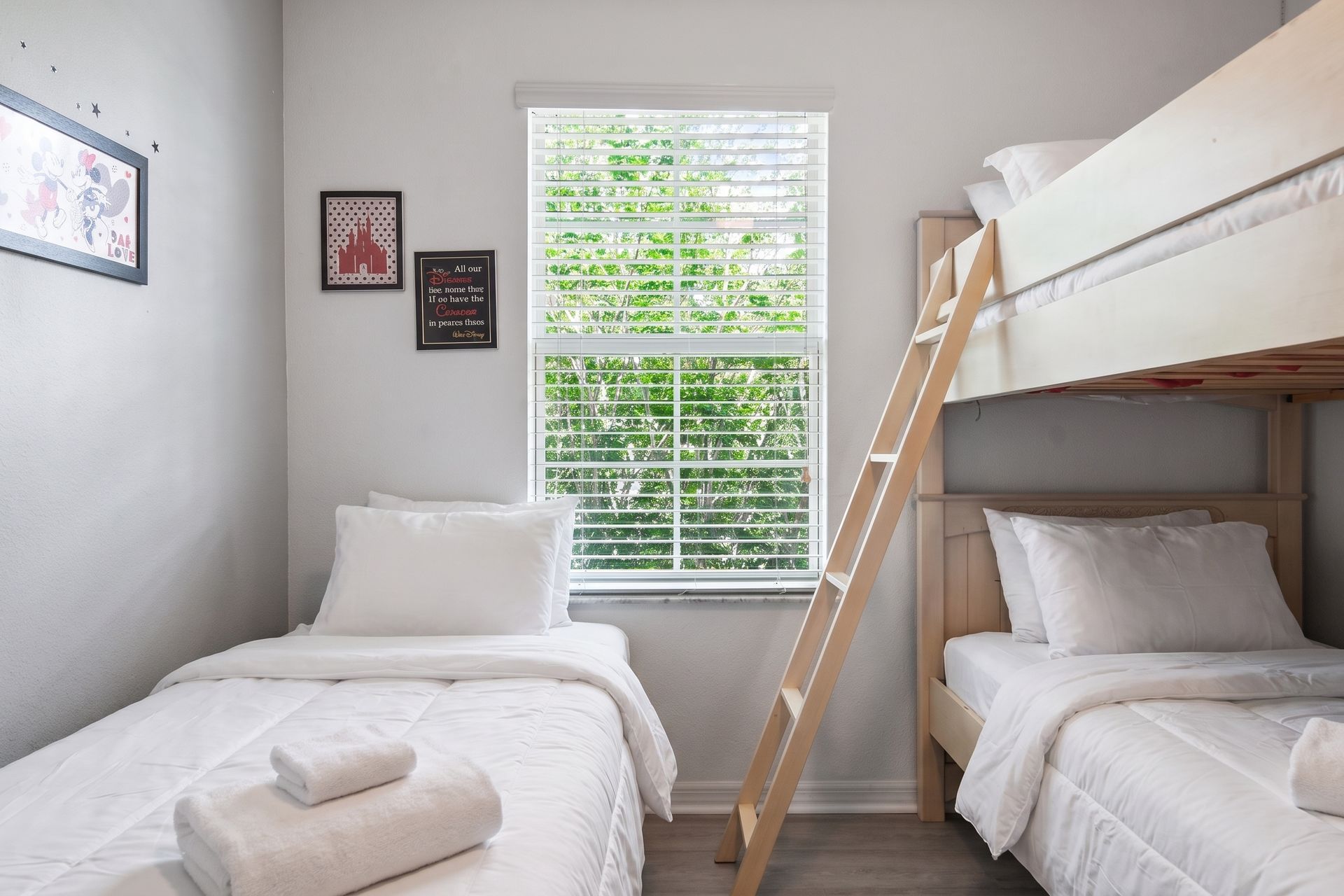 Charming bedroom with bunk beds, playful decor, and natural light!