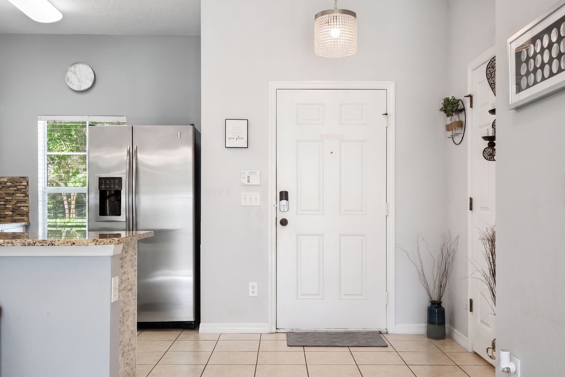 Bright entryway with modern touches and easy kitchen access!