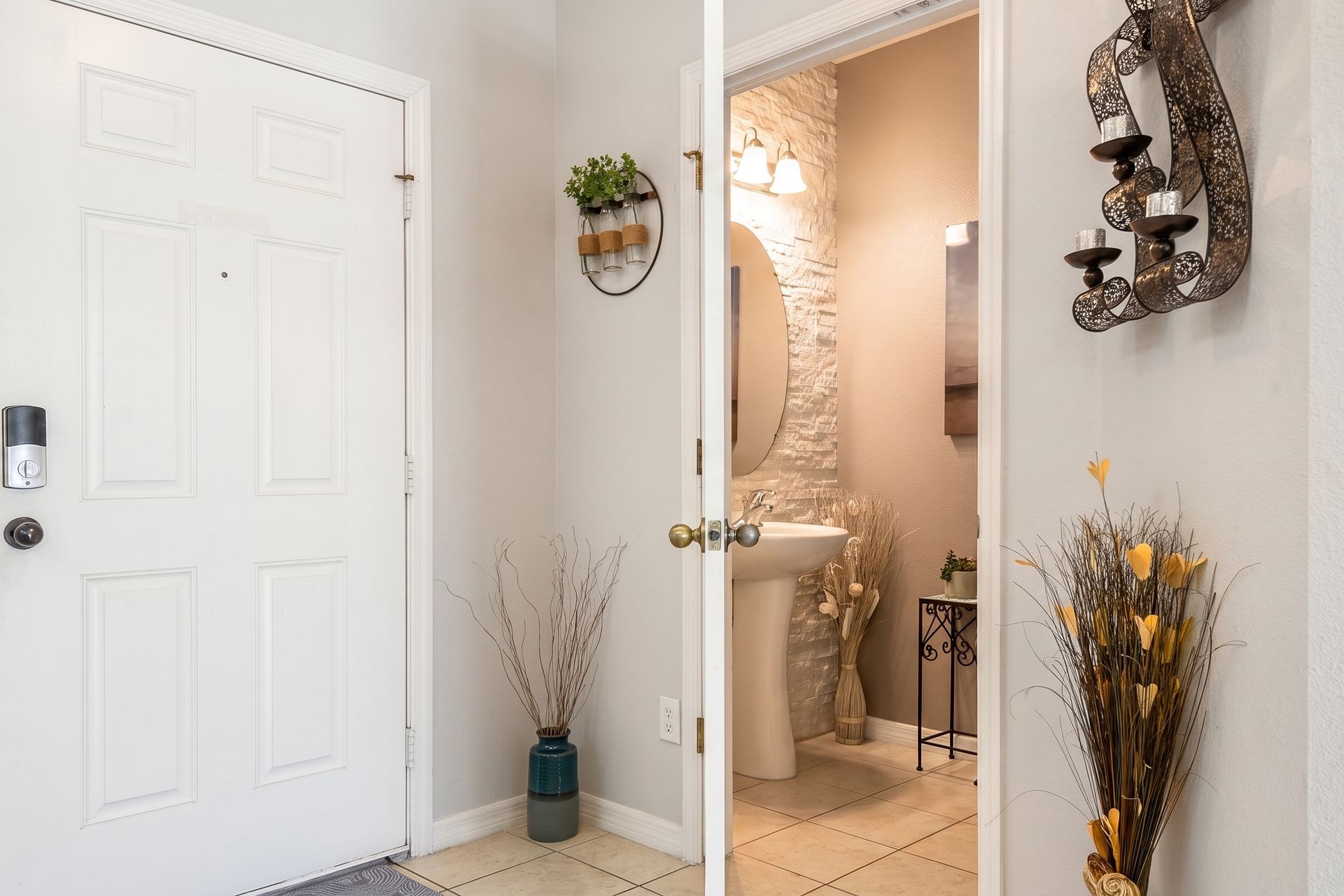 Charming entryway with a glimpse into a stylish powder room!