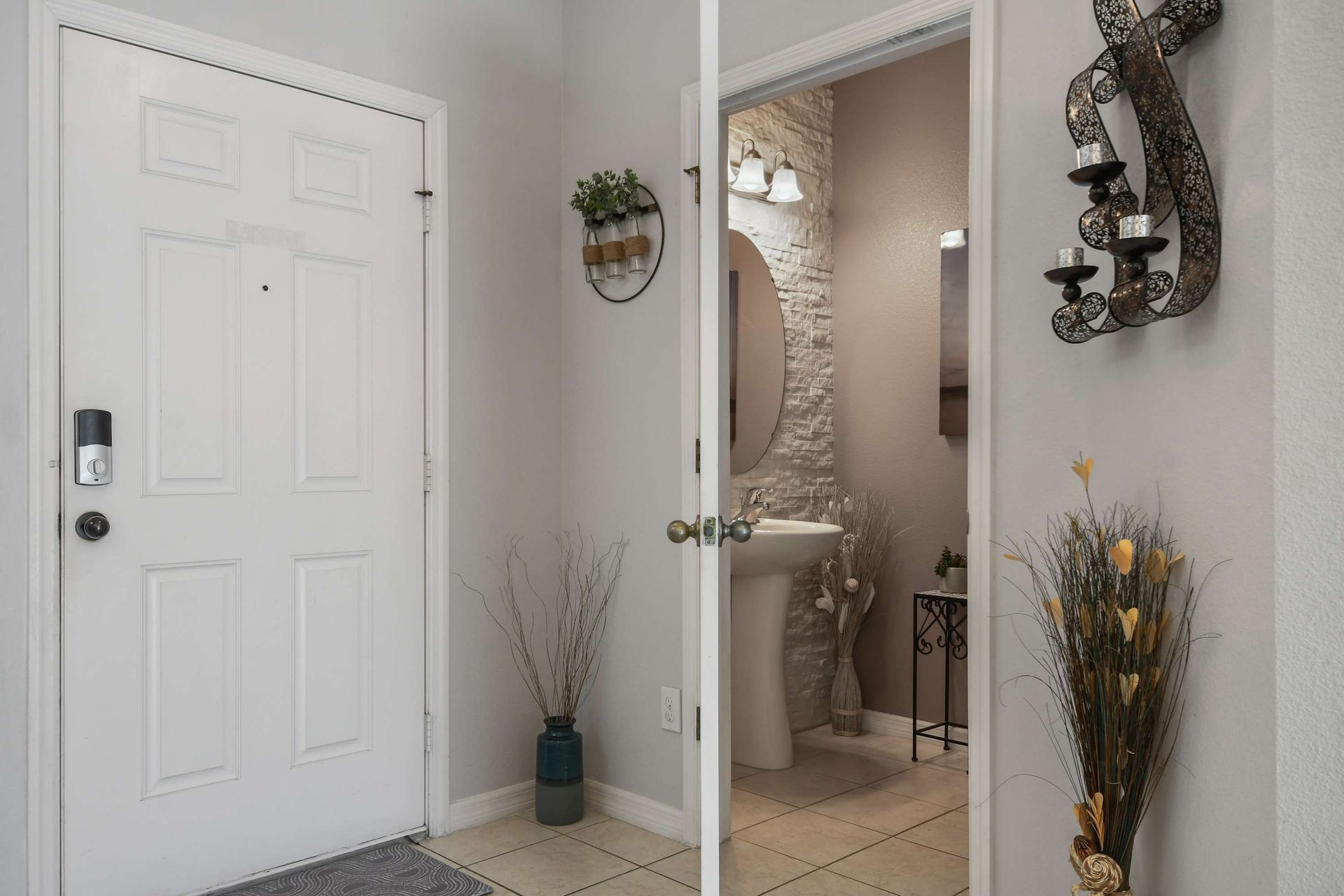 Charming entryway with a glimpse into a stylish powder room!