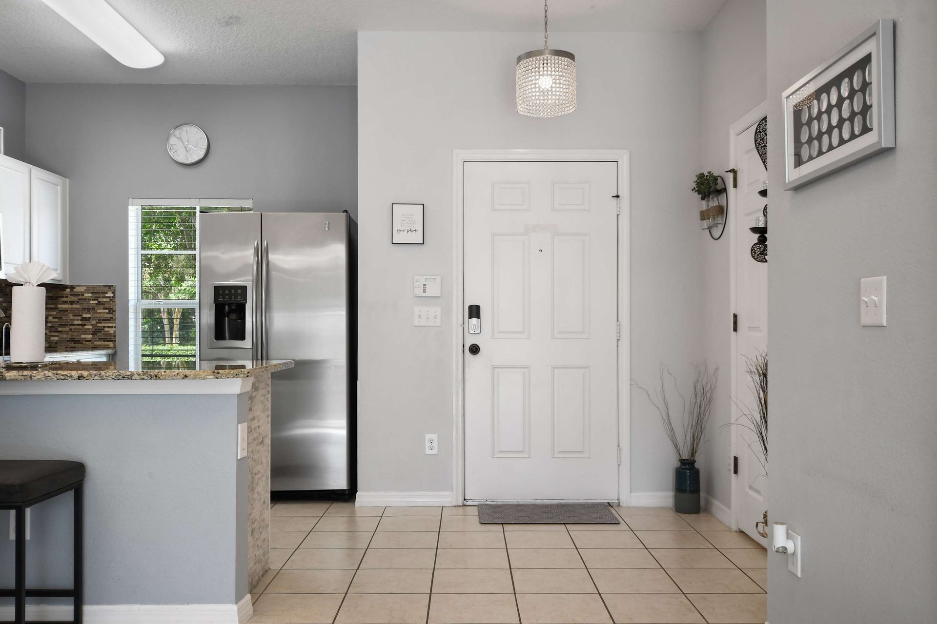 Bright entryway with modern touches and easy kitchen access!