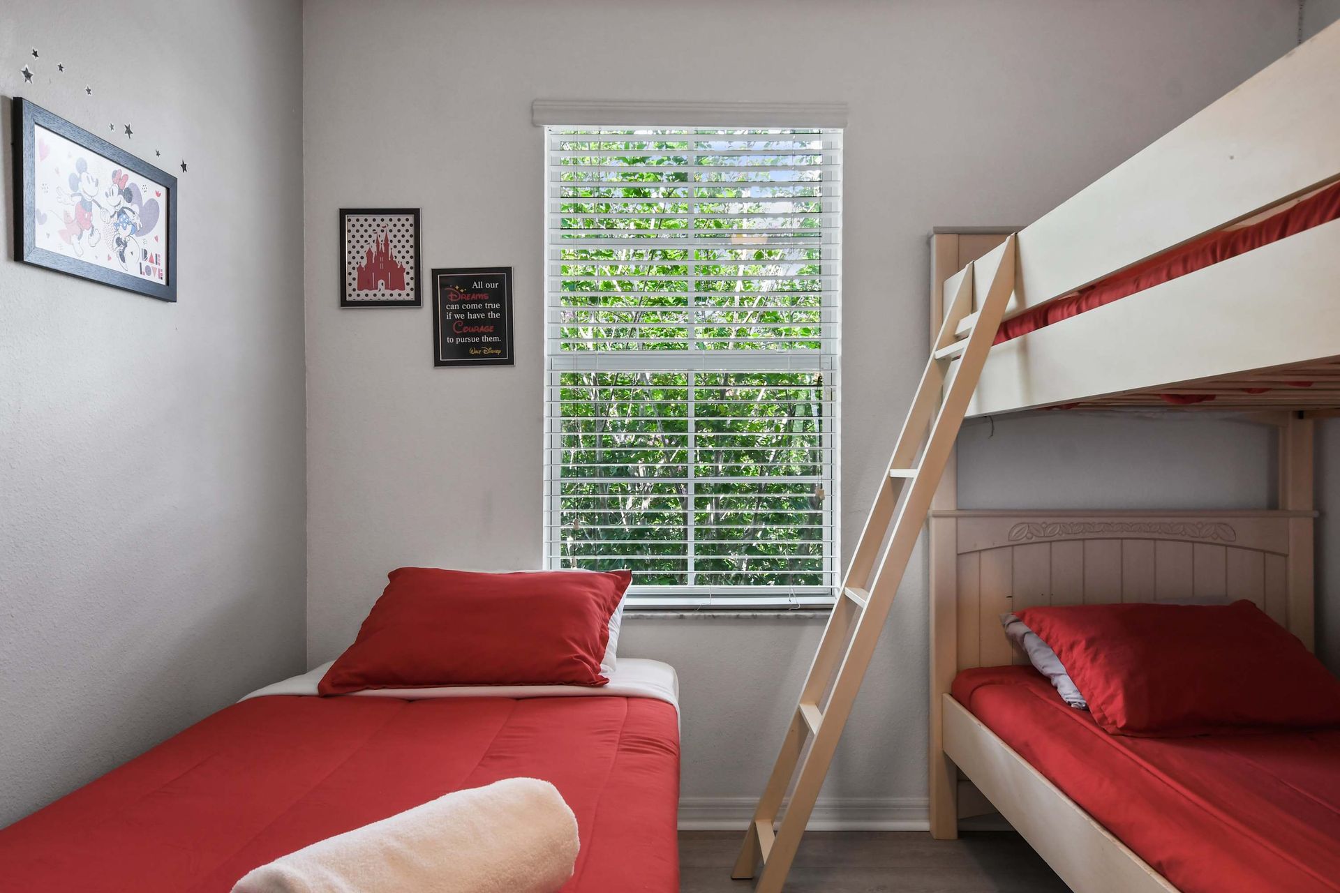 Charming bedroom with bunk beds, playful decor, and natural light!