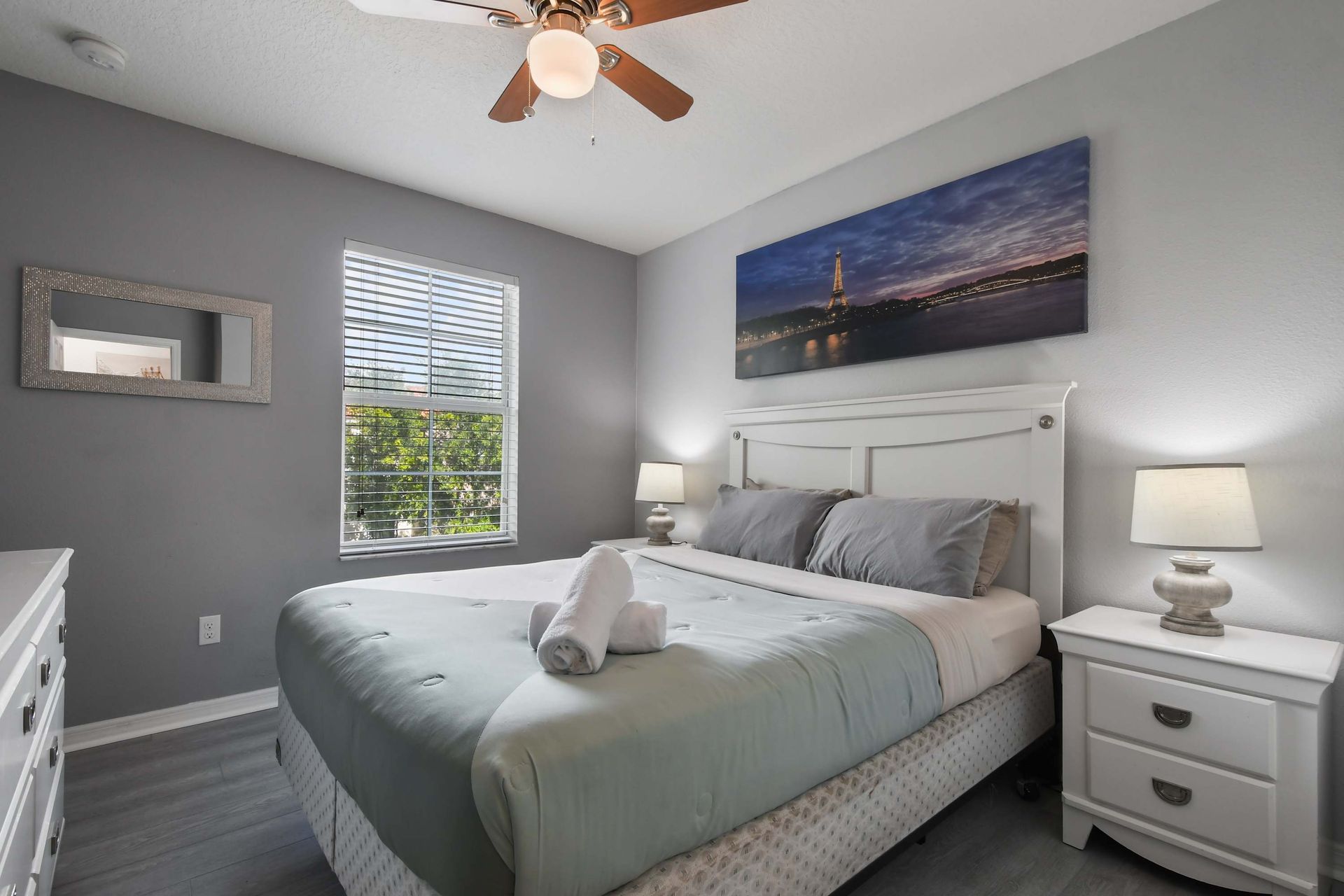 Tranquil bedroom with cozy decor, natural light, and plush bedding!