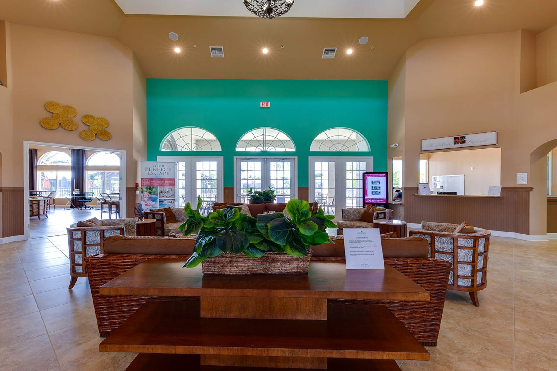 Stylish clubhouse with cozy seating and vibrant tropical decor!