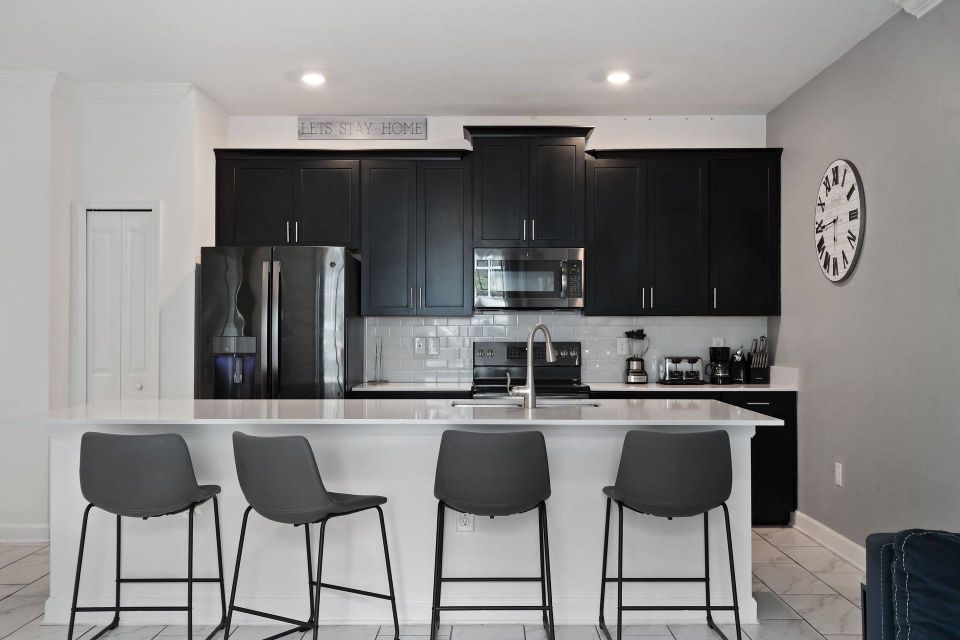 Modern Kitchen w/ Sleek Black Cabinets & Spacious Breakfast Bar!