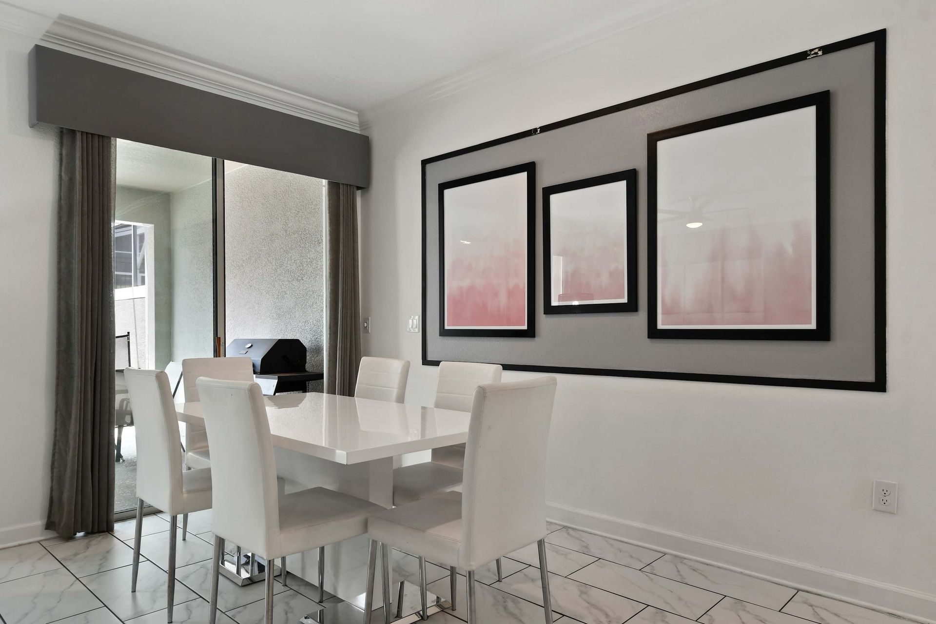 Chic Dining Area with Modern Art & Patio Access for Easy Meals!