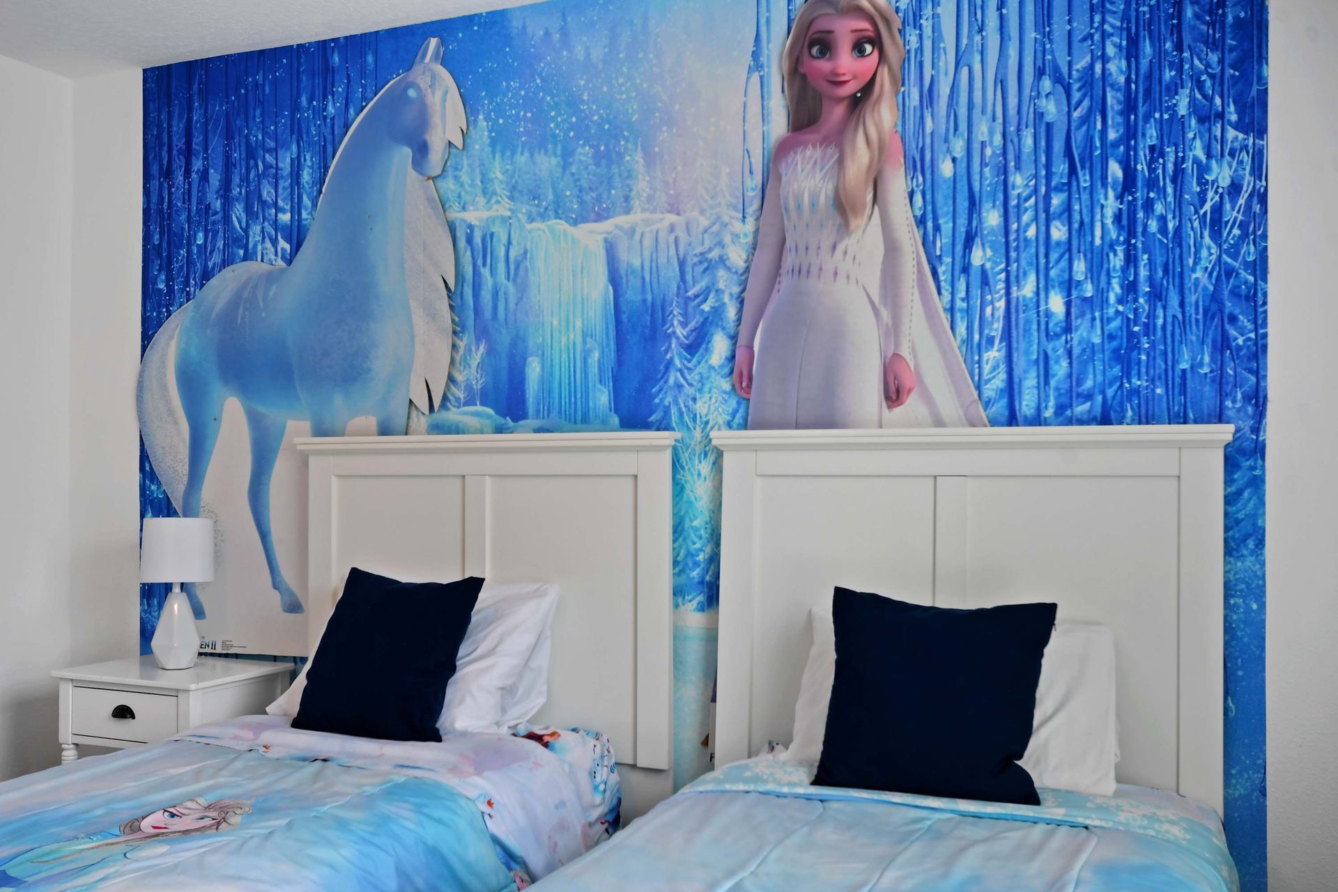 Enchanting Frozen-Themed Bedroom: Twin Beds & Magical Wall Art!