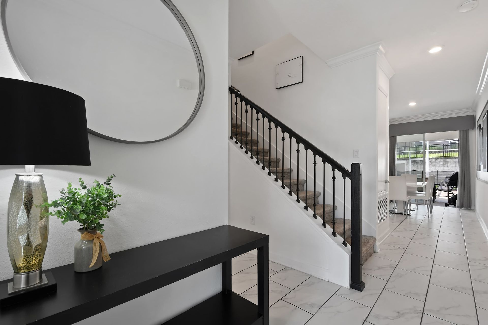 Elegant Hallway with Modern Mirror, Stylish Staircase & Open Layout