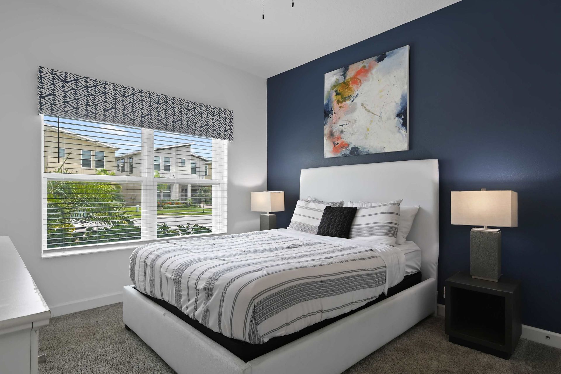 Stylish Bedroom w/ Bold Accent Wall, Comfy Bed & Natural Light!