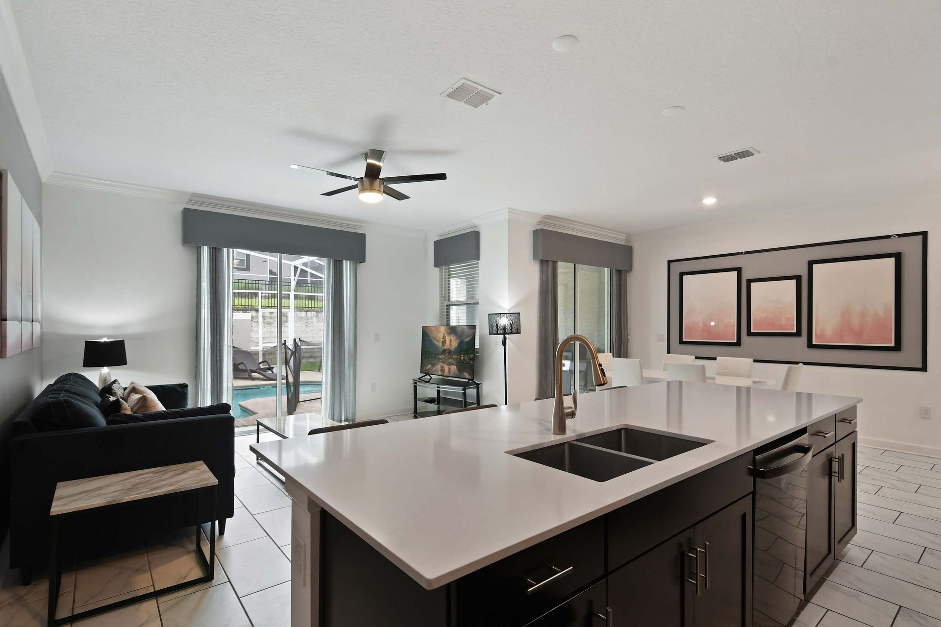 Open Layout: Modern Kitchen Island, Living Space & Poolside Views!