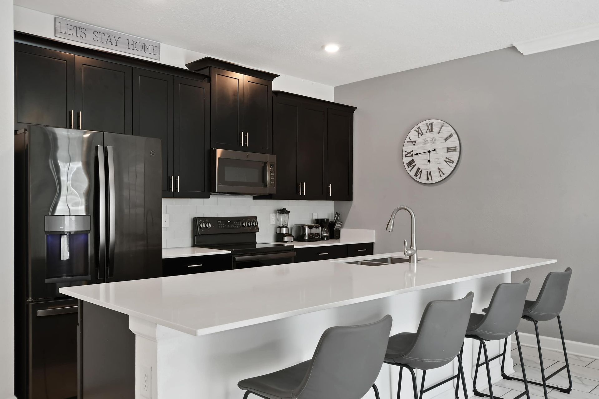 Stylish Kitchen w/ Sleek Black Appliances & Breakfast Bar Seating!