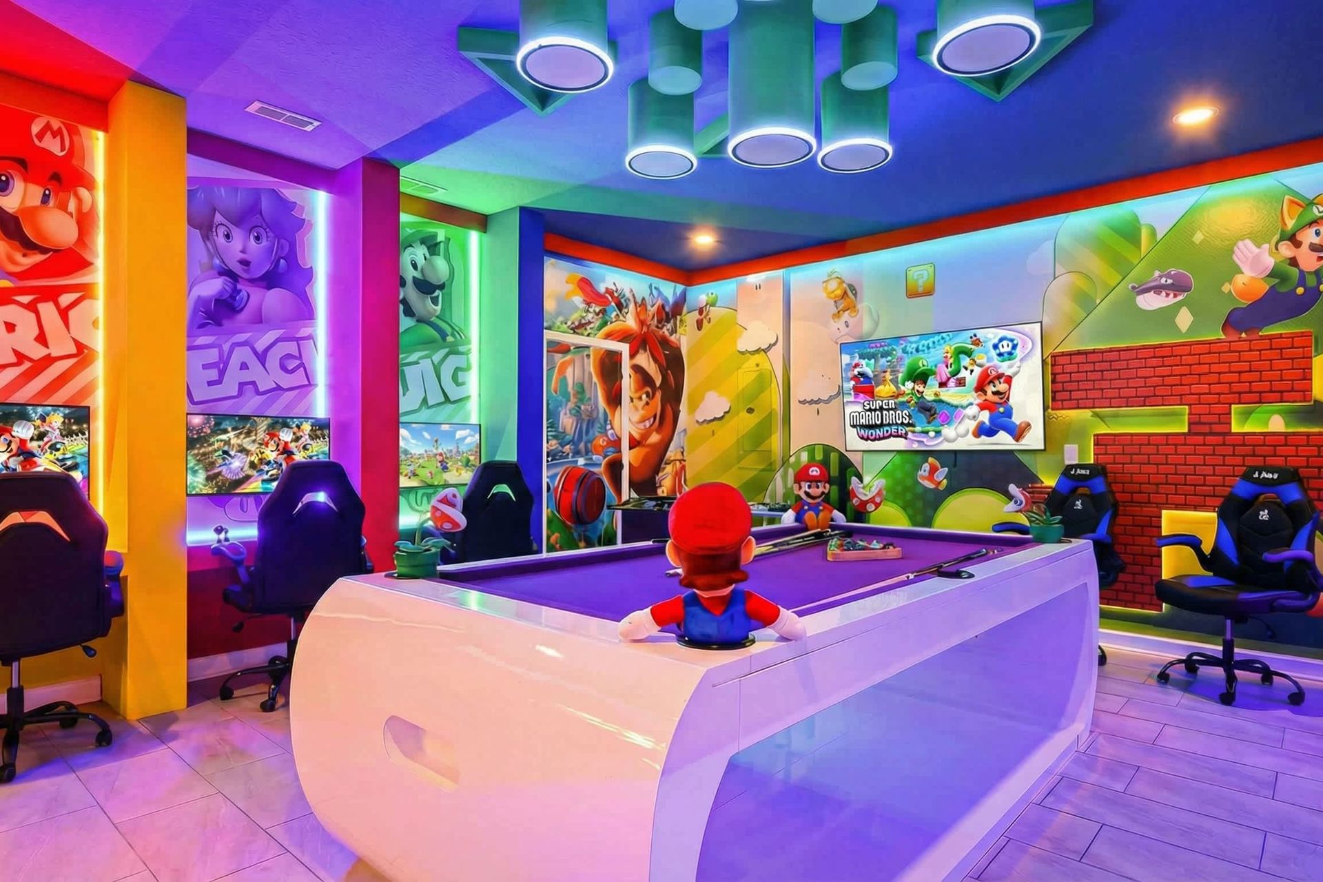 Ultimate gaming paradise with themed décor, neon lights, gaming stations, and a pool table.