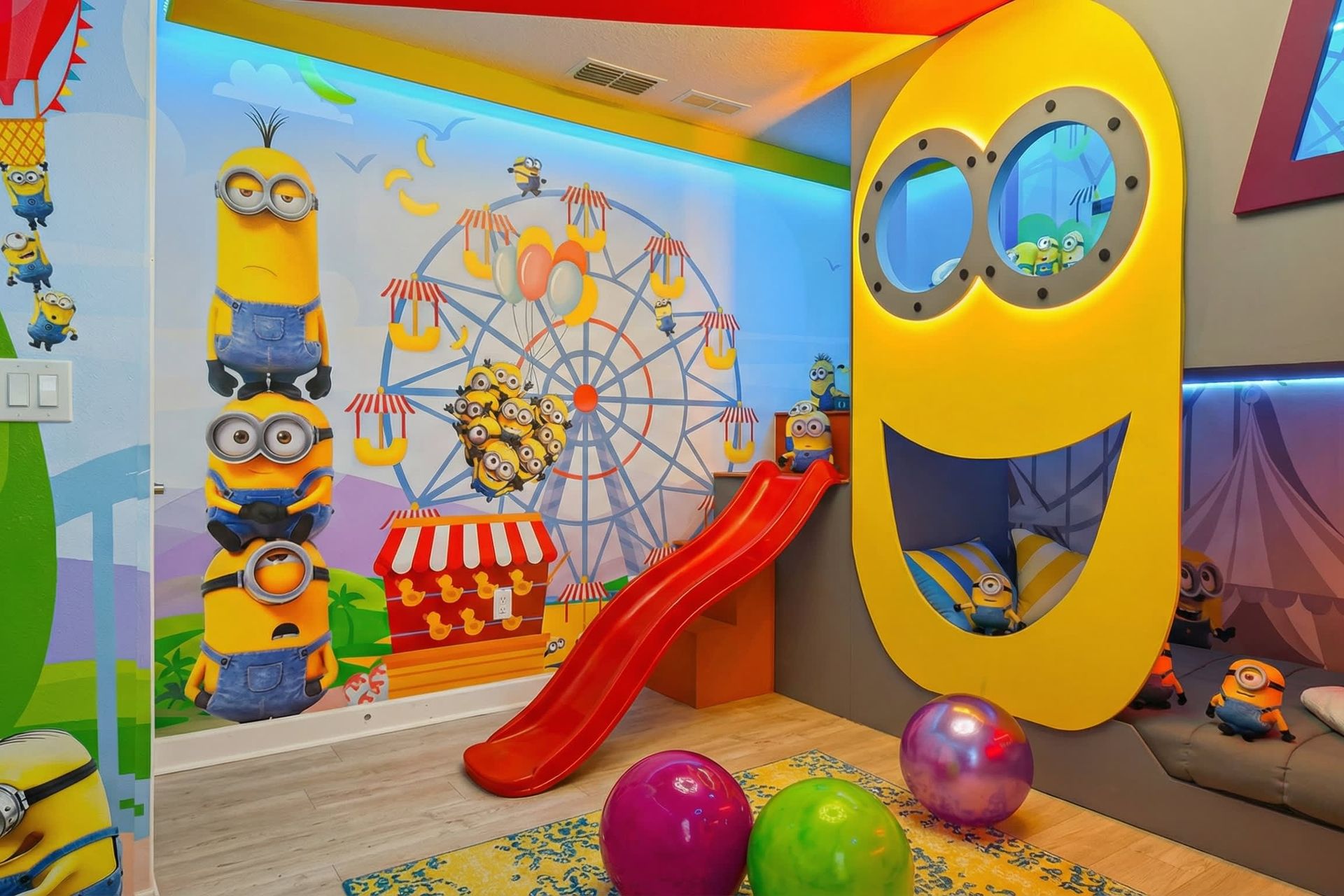 Immerse in a vibrant Minion-themed kids' paradise with slides, murals, and fun beds