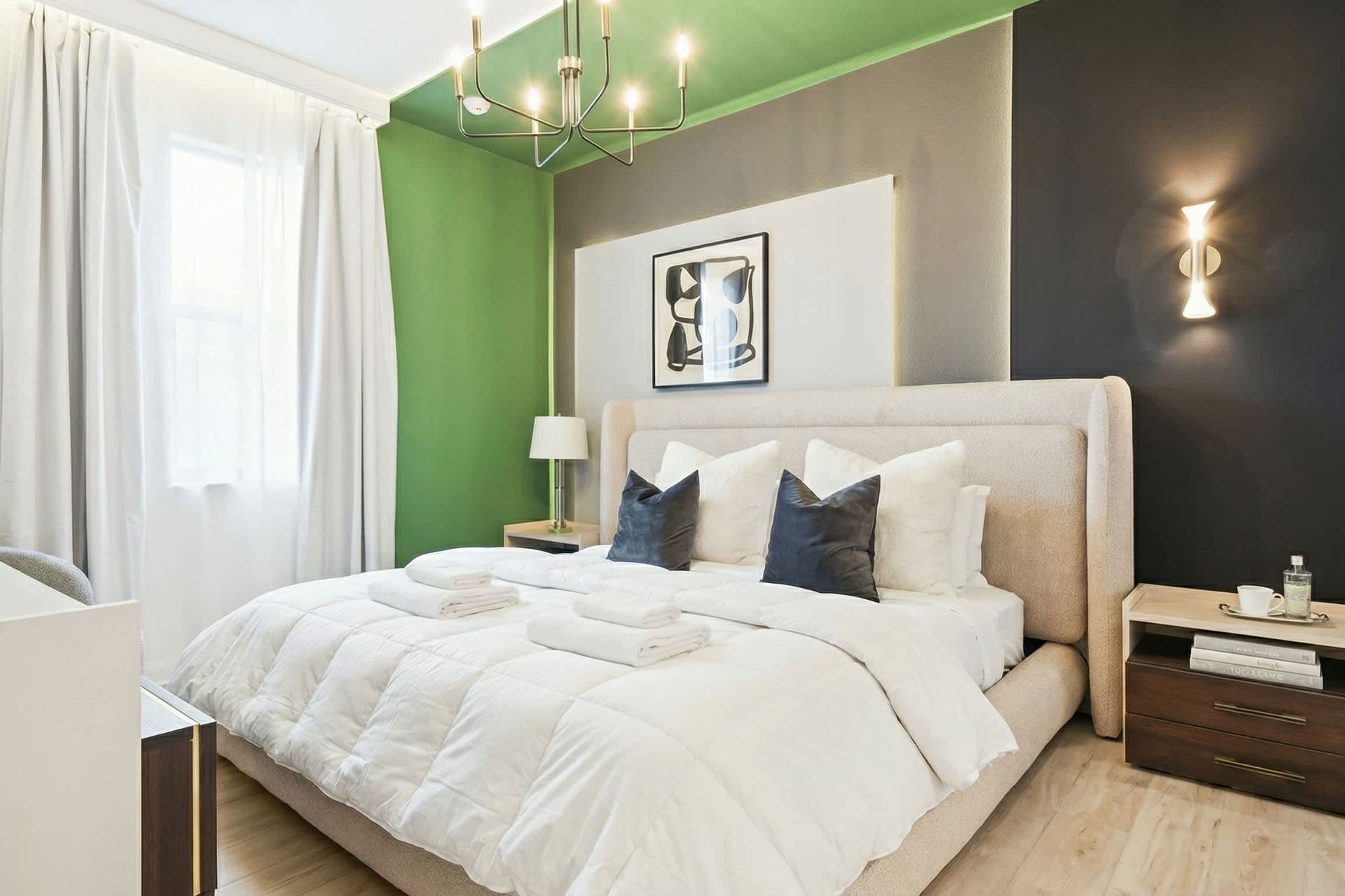 Modern and elegant bedroom with a plush king bed, chic lighting, and stylish decor.