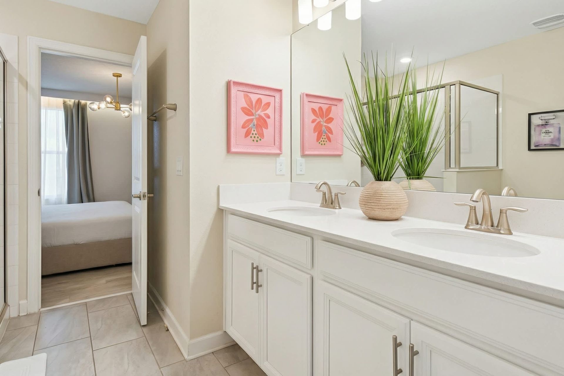 Bright and stylish bathroom with a dual vanity, modern décor, and a glass-enclosed shower.