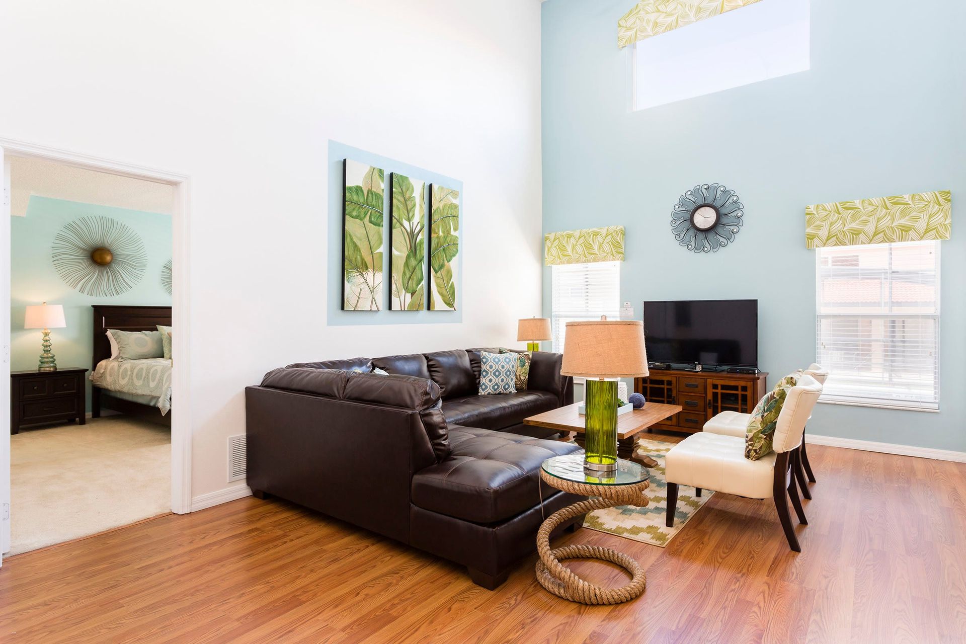 Living Room: Spacious and inviting, the area features a cozy sofa, perfect for a family reunion, providing comfort and a warm atmospher