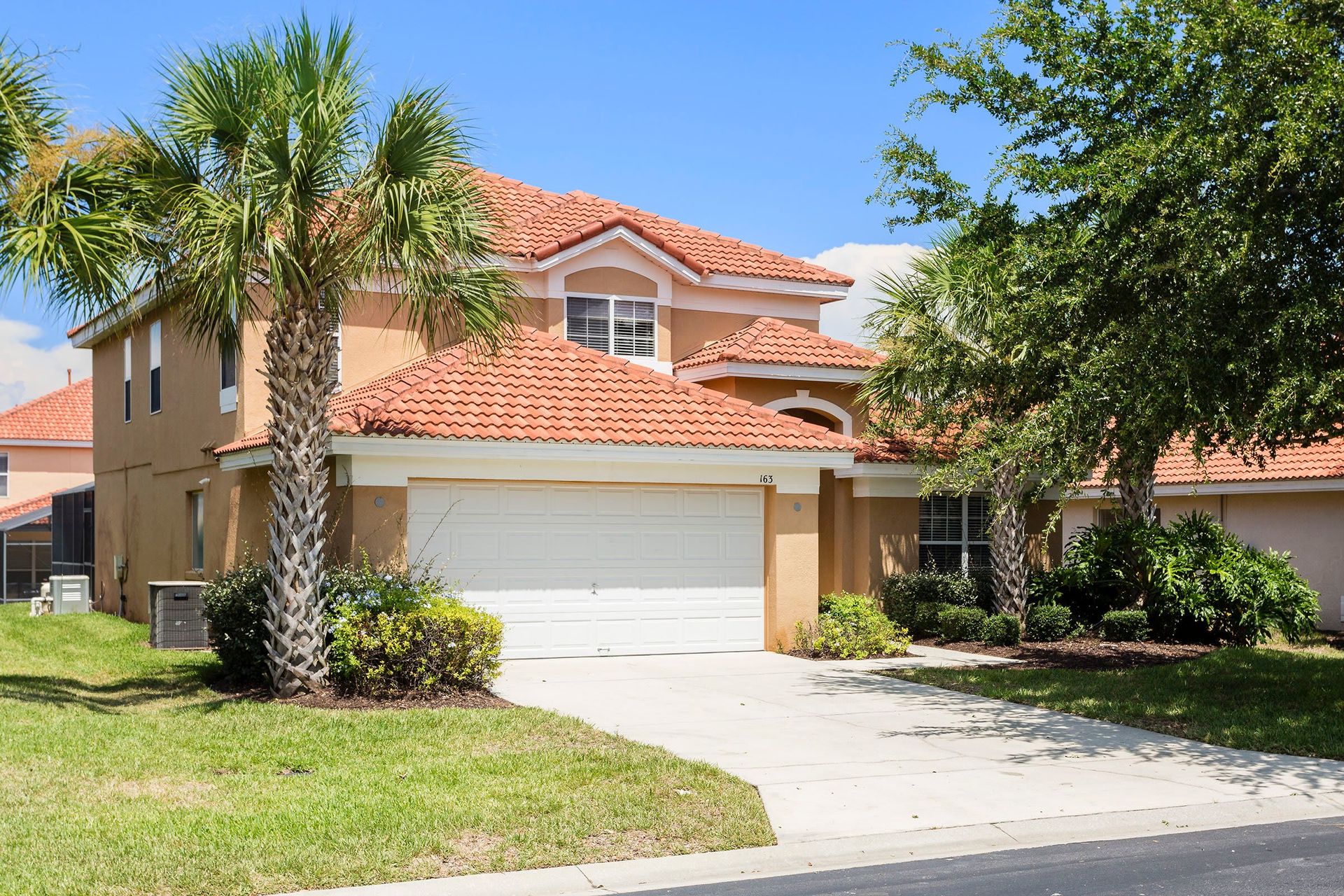 Home Exterior: Modern elegance meets lush greenery, creating a harmonious and inviting outdoor space