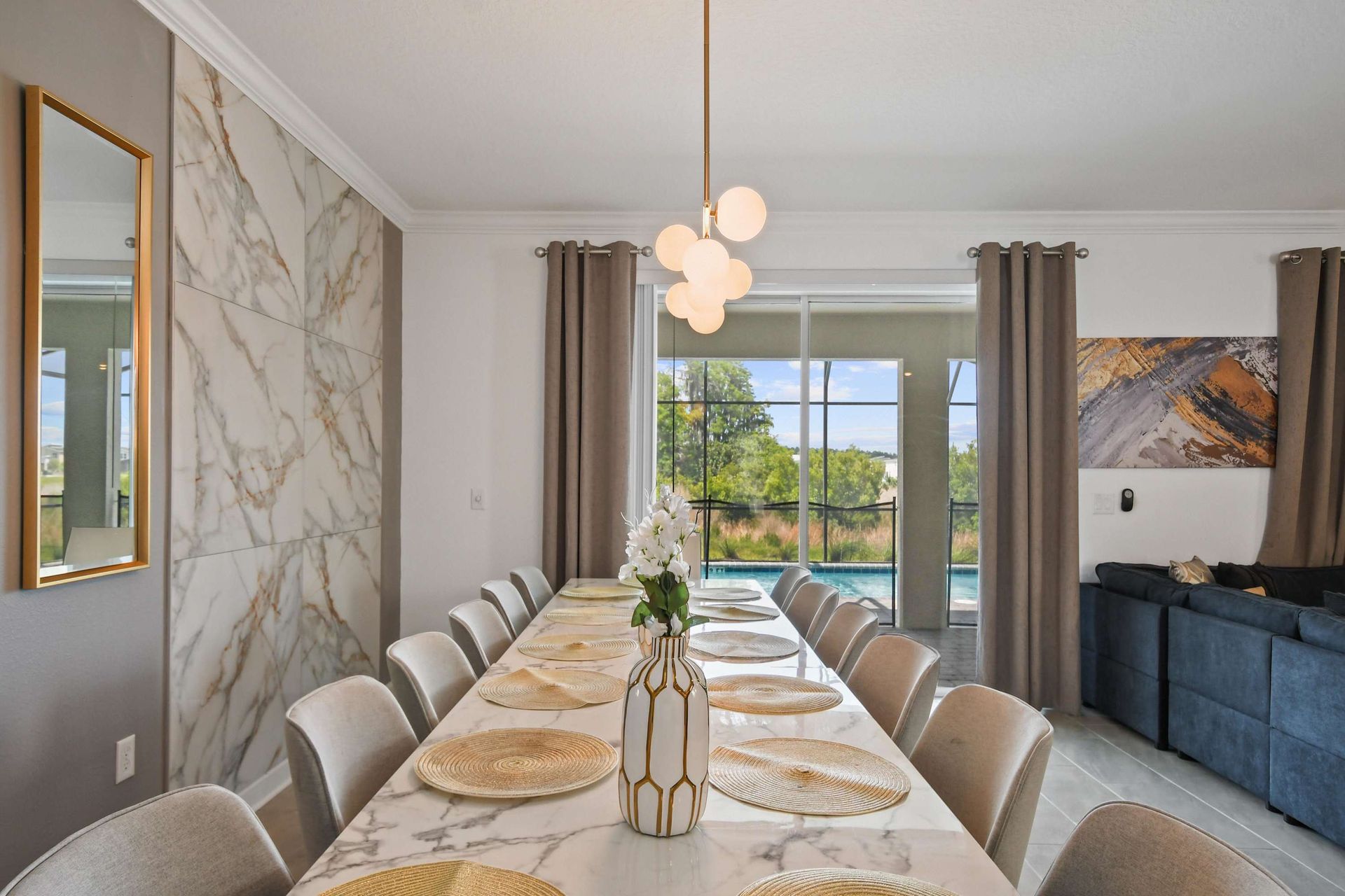 Host elegant family dinners in this luxurious dining space with seating for all. Enjoy the modern design and beautiful views through the large sliding glass doors.