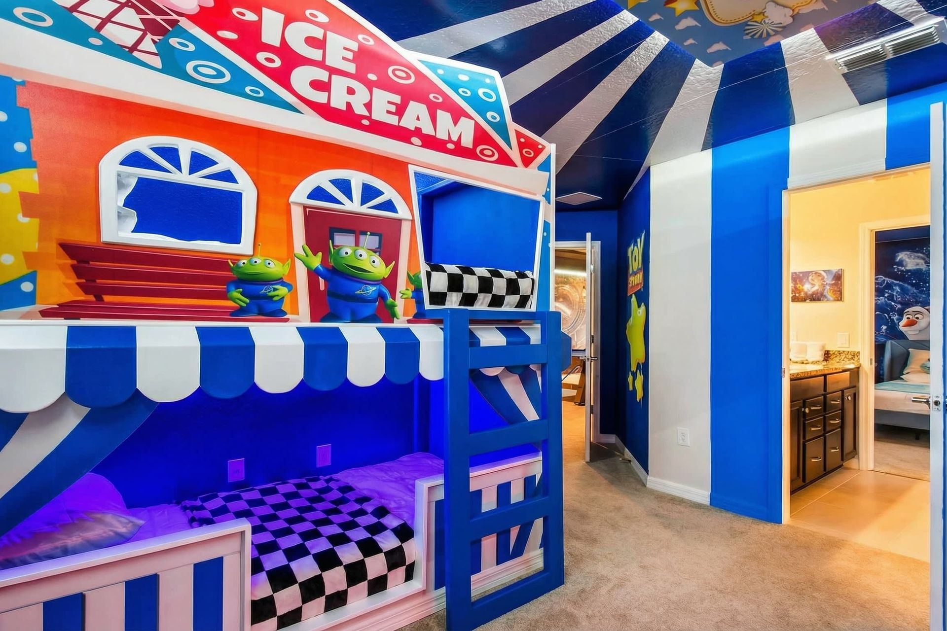 Colorful Toy Story bunk room with custom ice cream stand beds and playful murals.