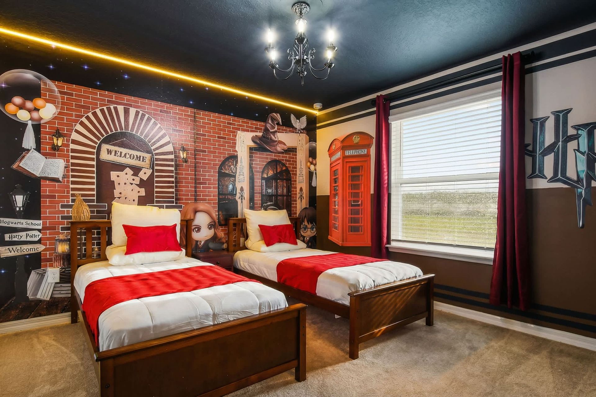 Whimsical Harry Potter room with twin beds and magical mural details.
