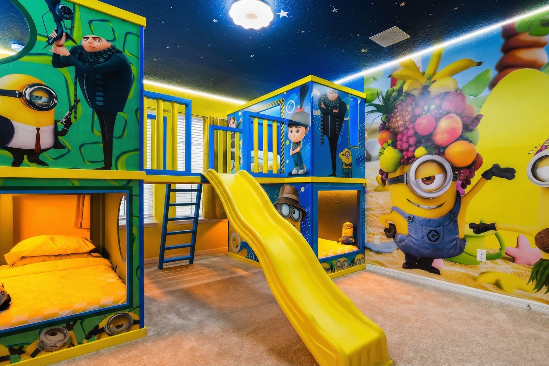 Sleep and play in a vibrant Minions paradise featuring slides and cozy bunk beds.