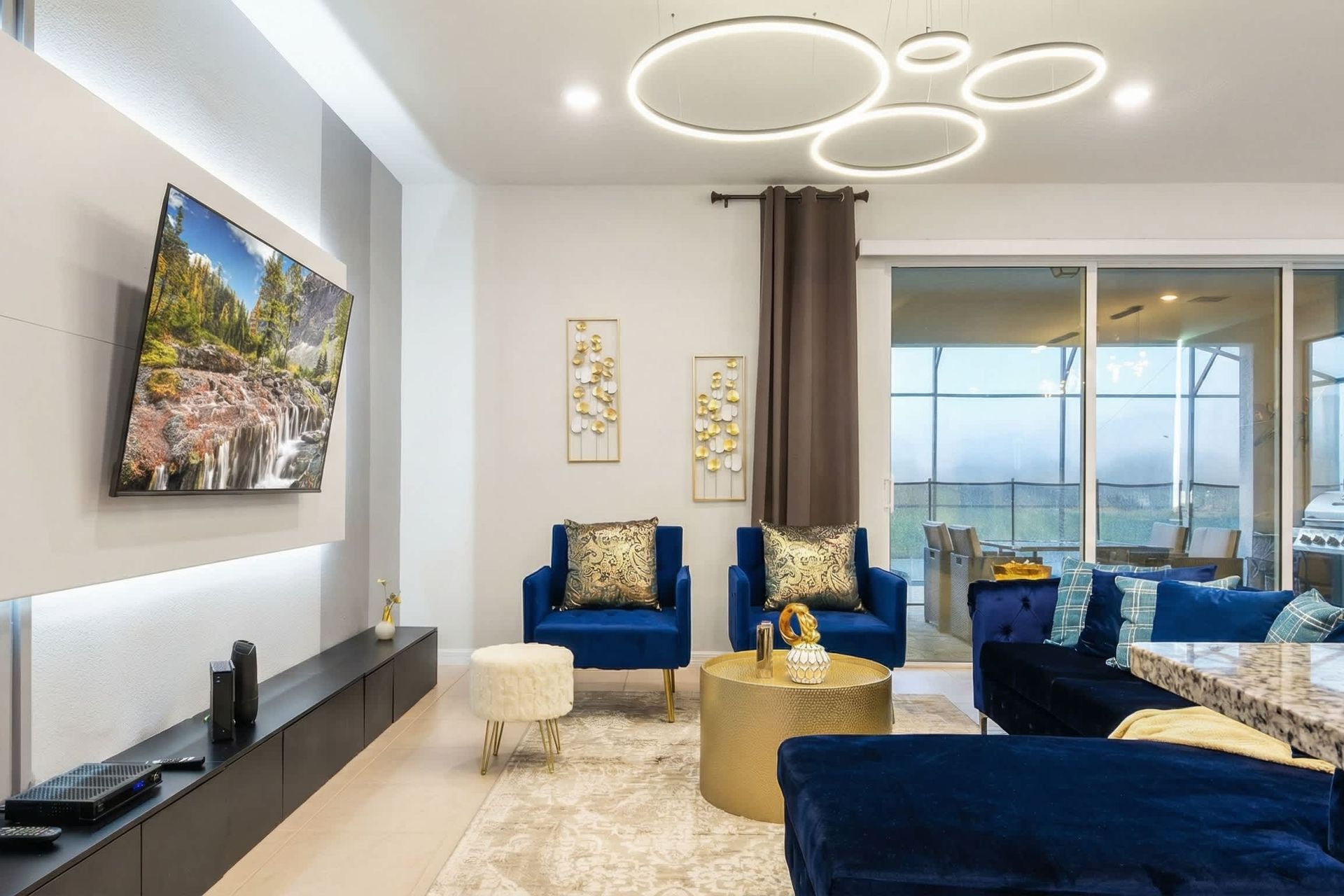Elegant lounge area, modern accents, comfy seating, perfect for family gatherings.