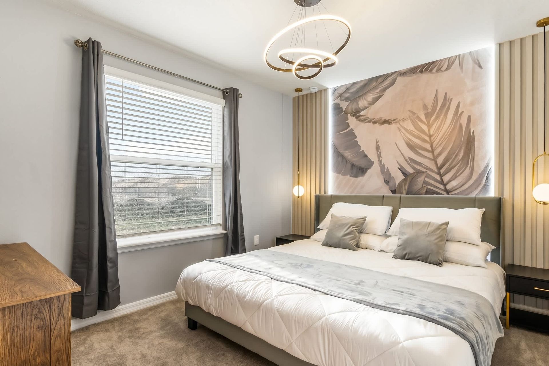 Modern king suite with calming neutrals, artistic flair, and natural light.