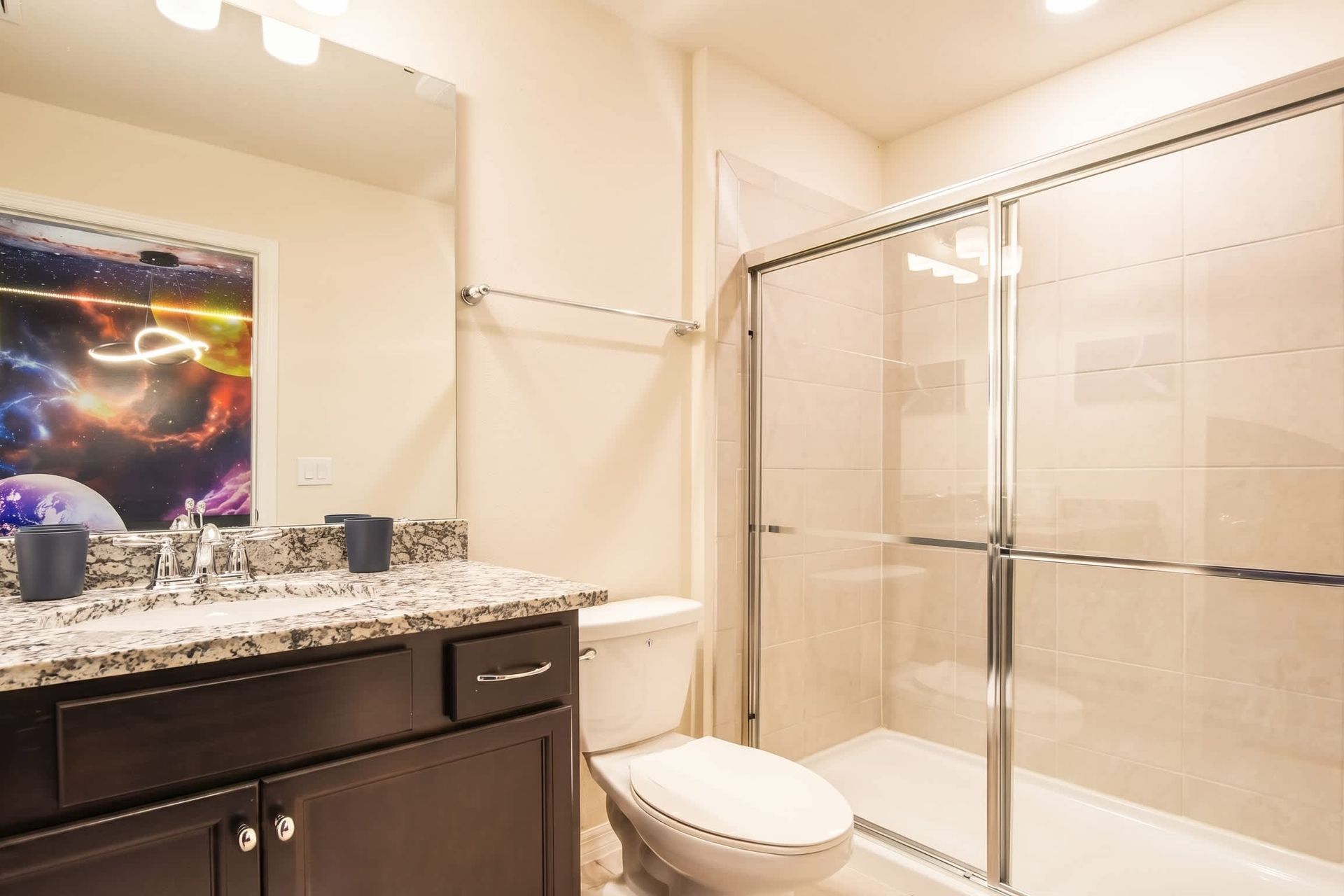 Modern bathroom with walk-in shower just steps from the galactic bedroom.