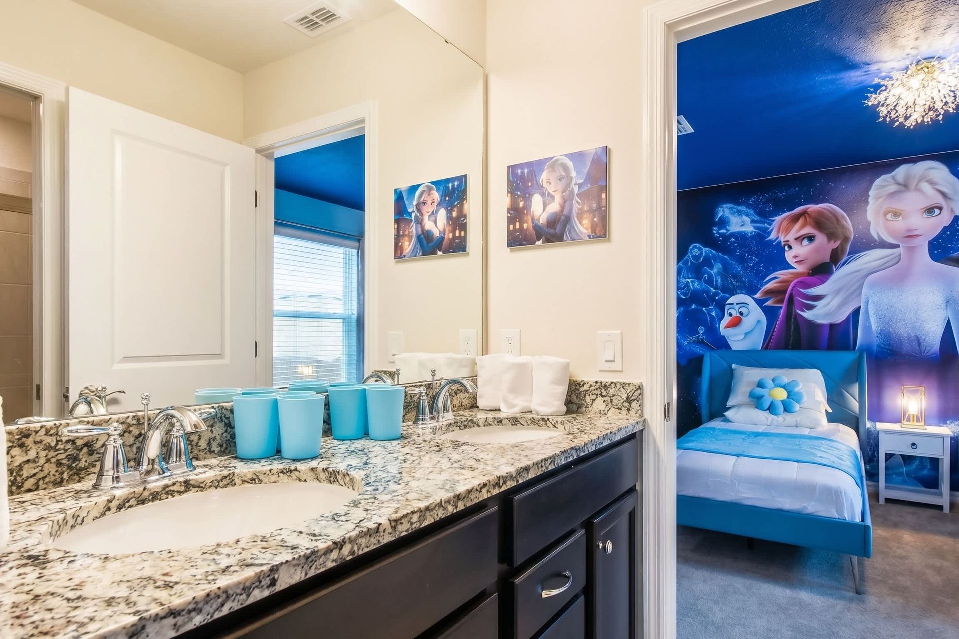 Frozen-themed twin room with en suite double-sink vanity and modern finishes.