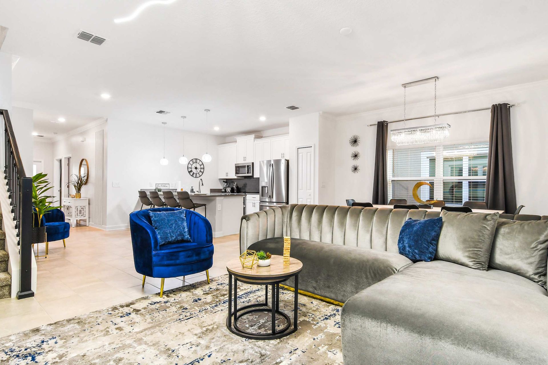 Generous family reunion space, featuring a comfy sofa in a spacious living area for shared moments