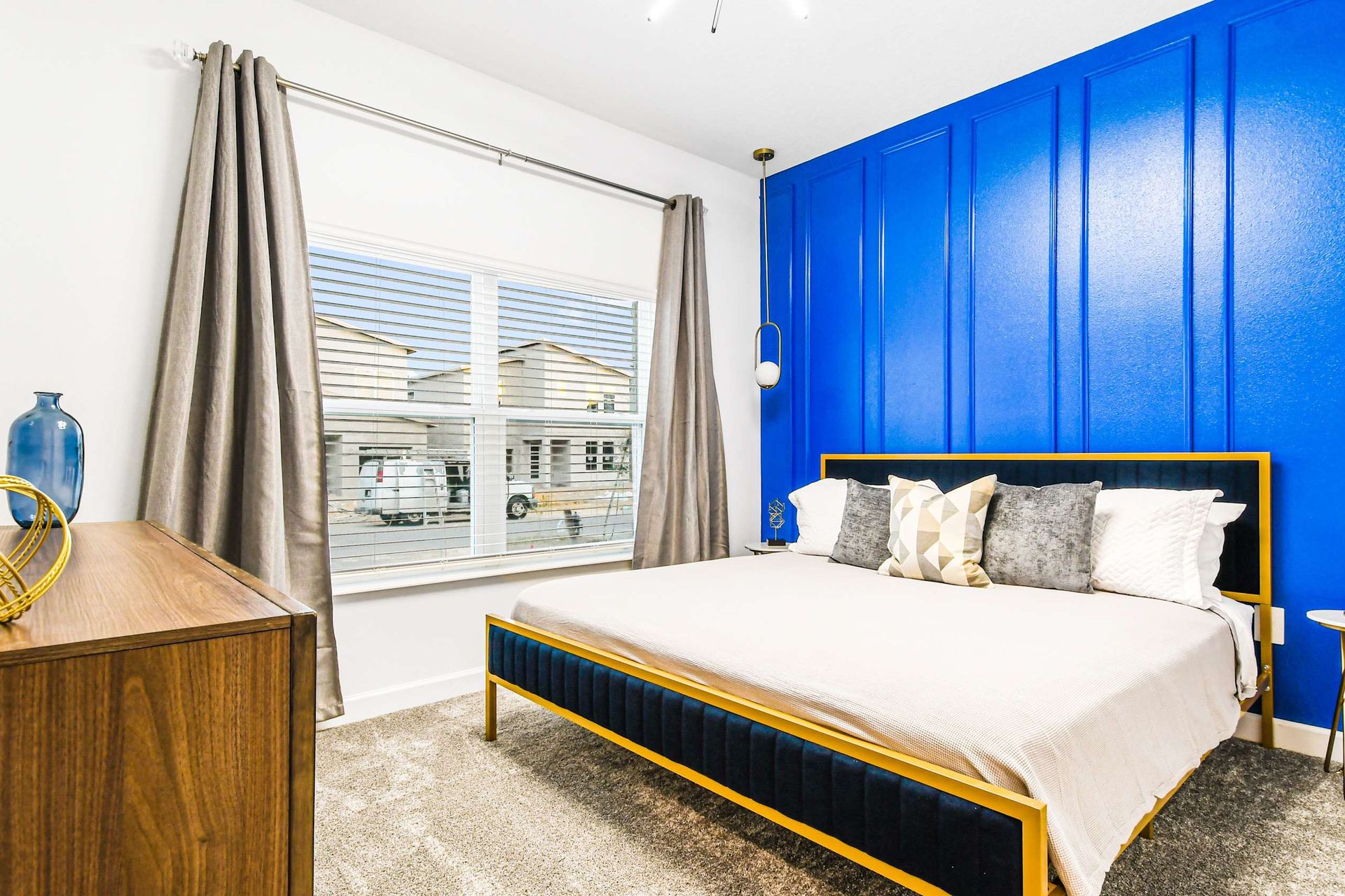 Generous bedroom with a cozy king bed, ensuring comfort in a spacious setting