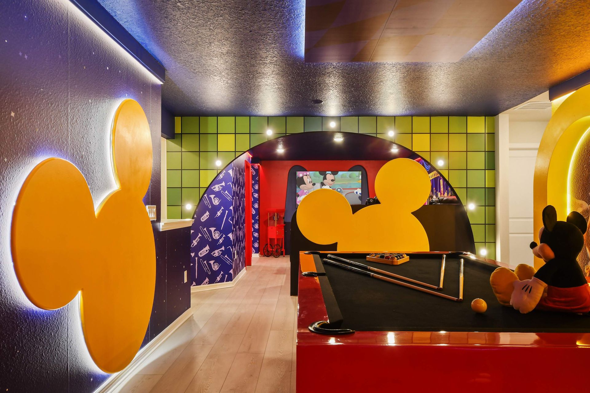 Play pool with Mickey magic in this colorful Disney-themed room!