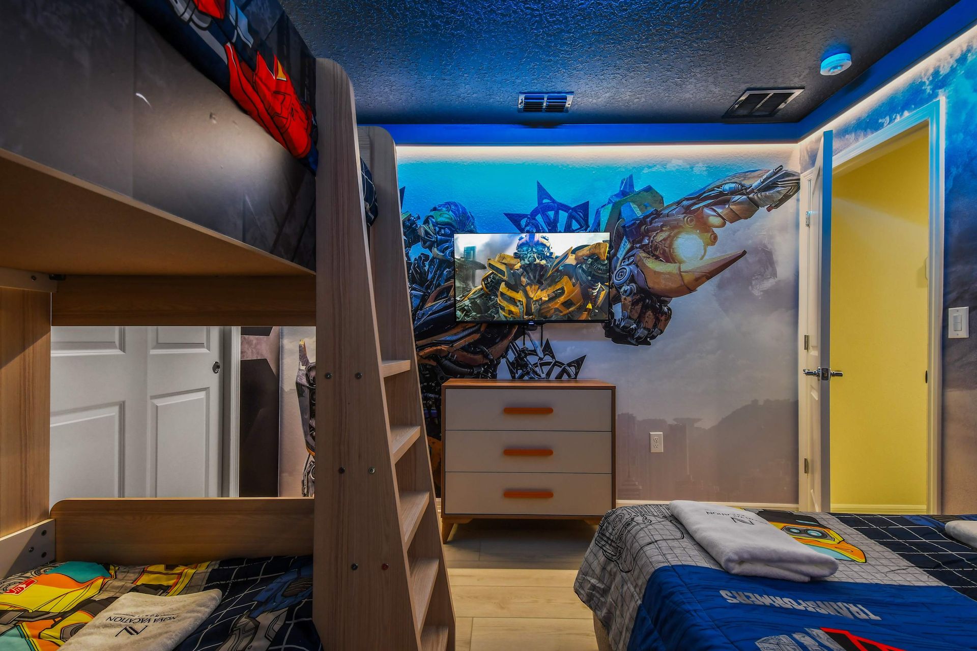 Transformers-themed bunk bed room with epic glowing artwork!