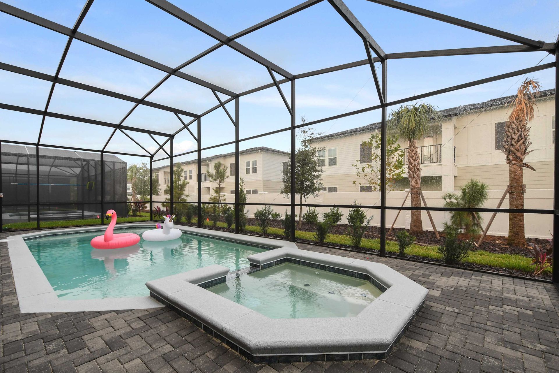 Relax in your private screened pool & spa with fun floaties!