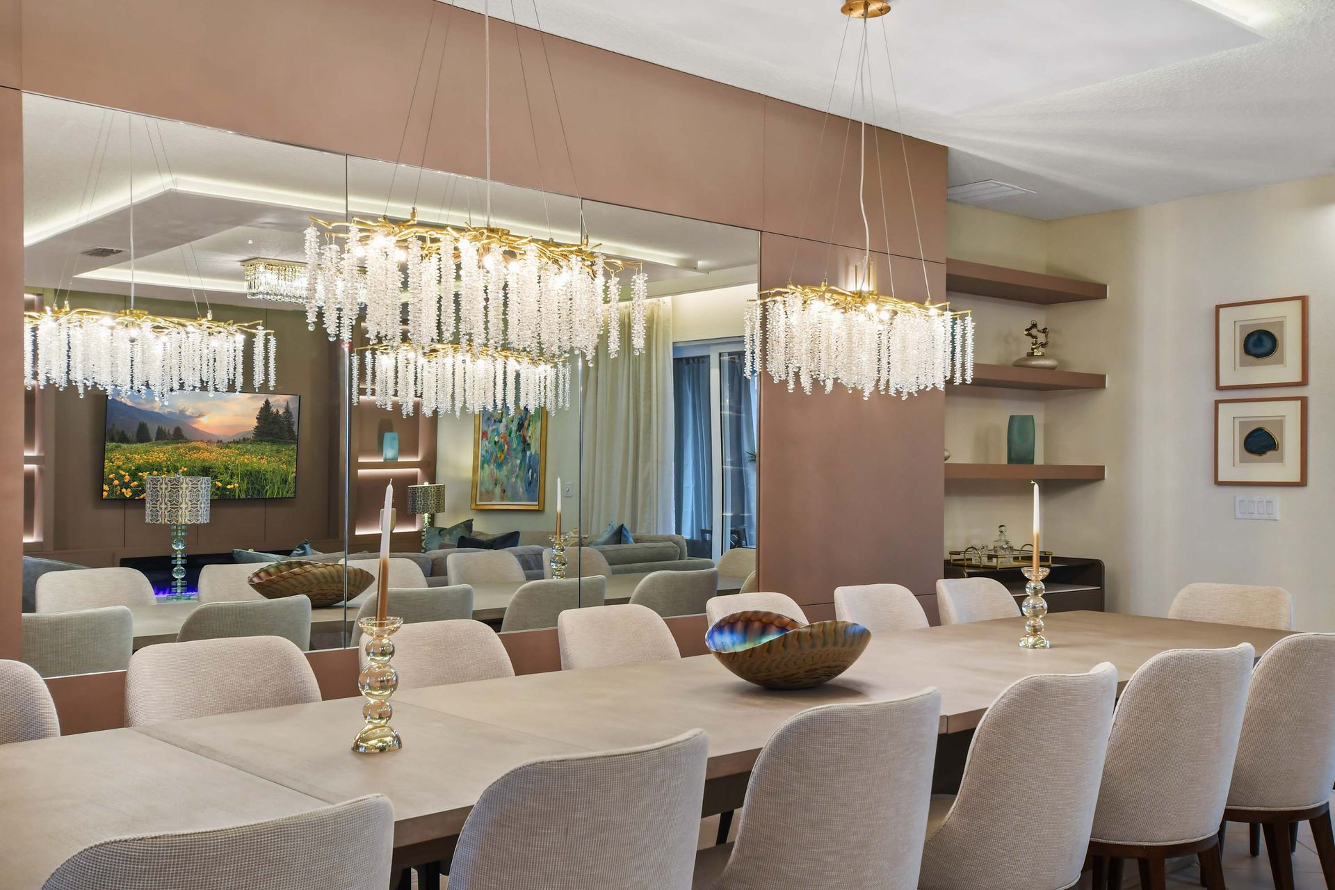 Elegant dining area with crystal chandeliers and seating for 10.