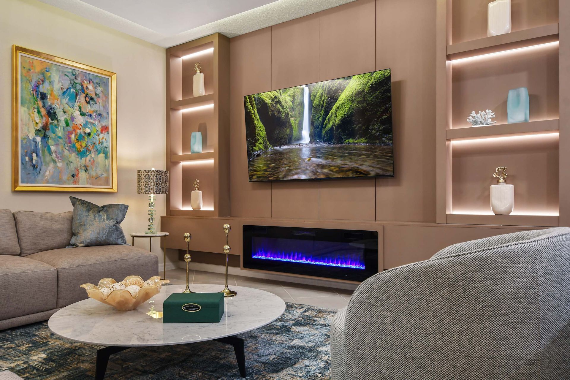 Stylish lounge with a fireplace, wall art, and a cozy ambiance.