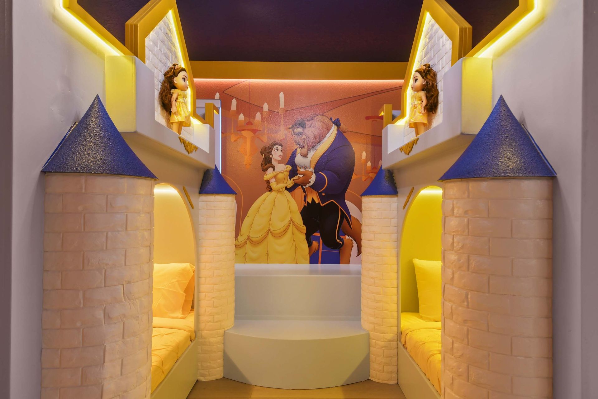 Experience the magic of a fairy tale in this enchanting Beauty and the Beast - themed bedroom, complete with castle -like bunk beds fit for royalty.