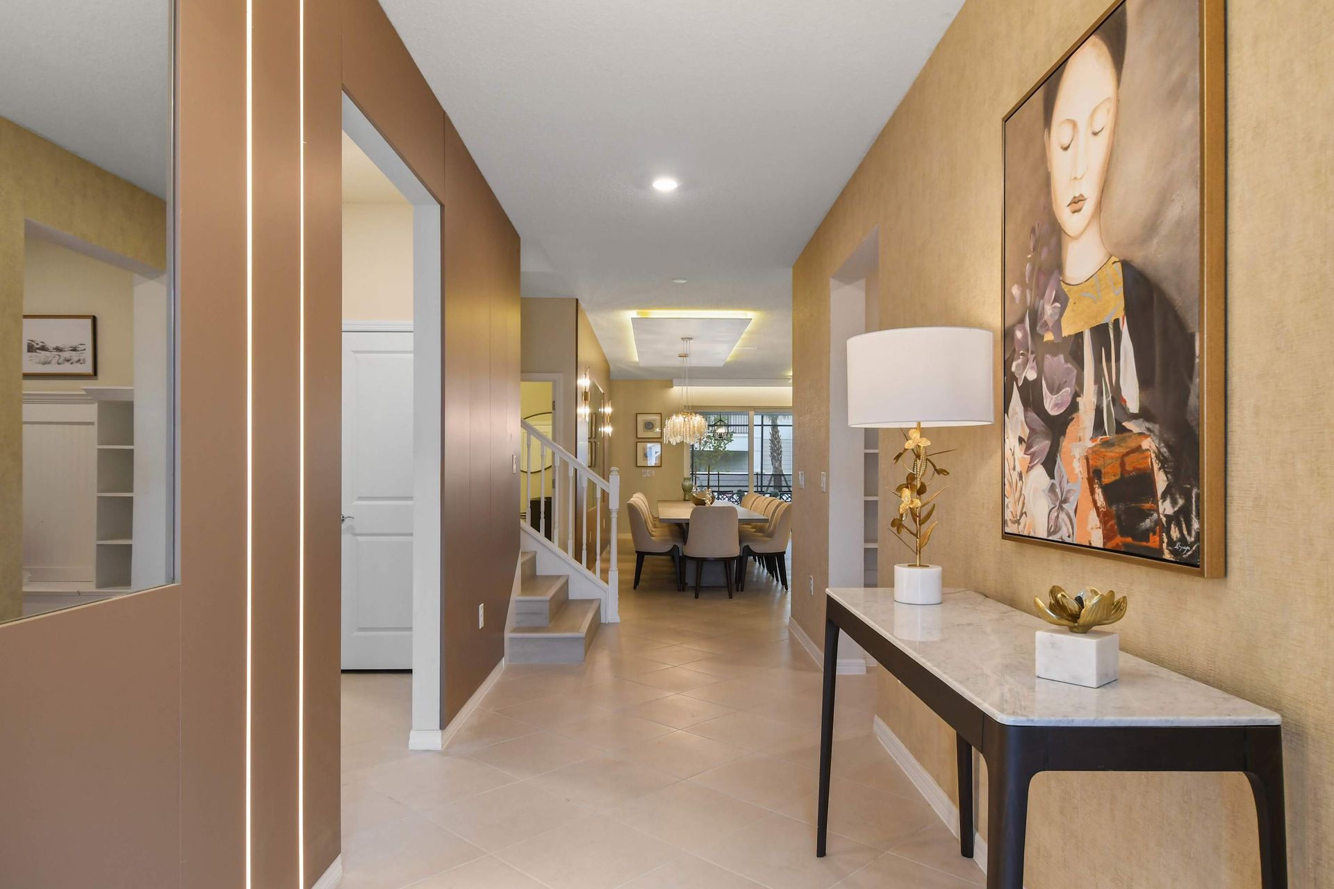 Stylish hallway decor leading to a bright, elegant dining area.